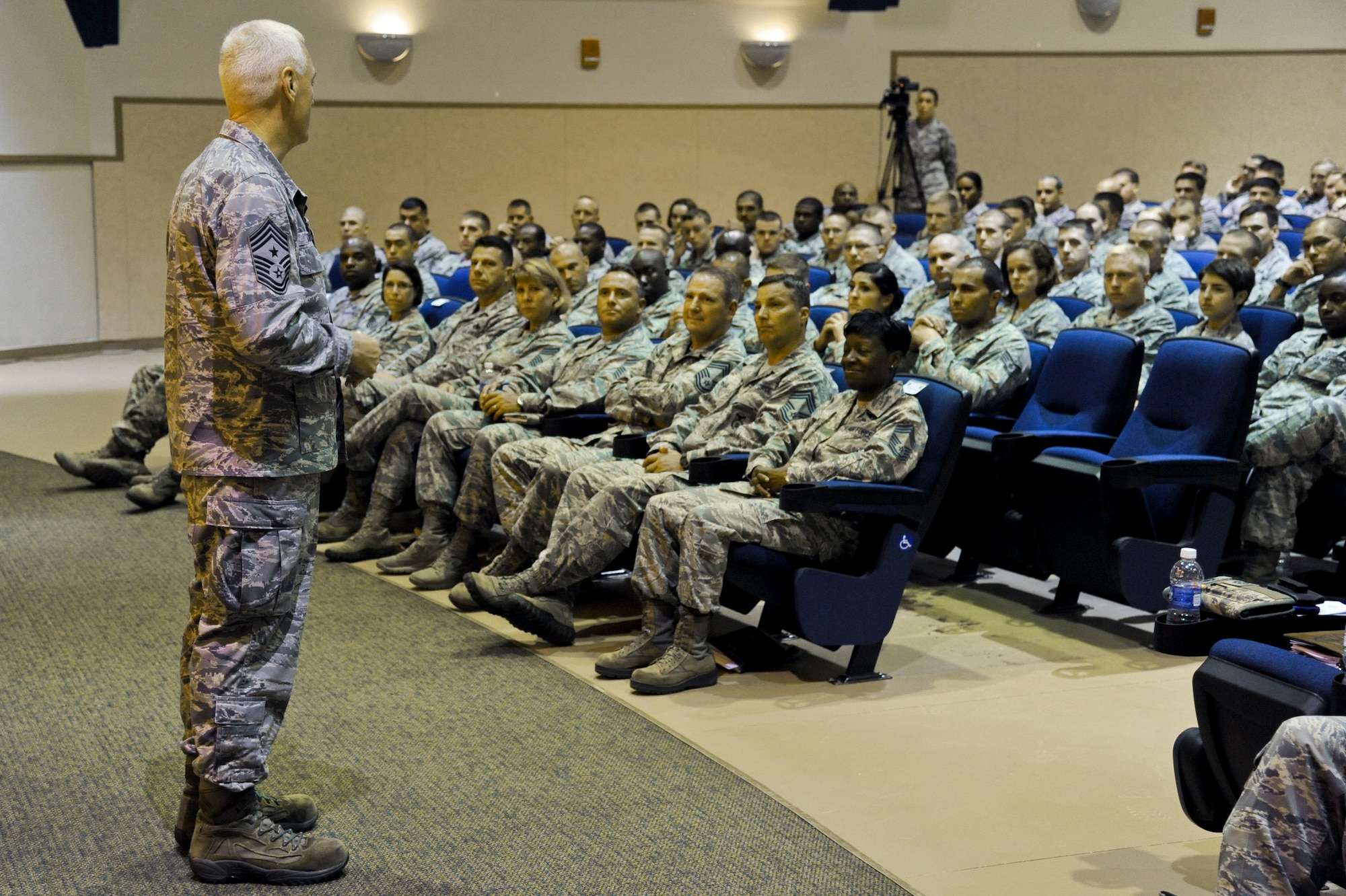 Chief Master Sgt. Richard A. Kaiser, Air Mobility Command command chief, speaks with a crowd of enlisted Airmen at an “all-call” at the base theater, MacDill Air Force Base, Fla., Sept. 26, 2013. Kaiser spoke about the future of EPRs and other enlisted topics. (U.S. Air Force photo by Airman 1st Class Ned T. Johnston/Released) 