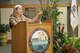 Danielle Van Orden talks about her role in past conflicts during the POW/
MIA Remembrance ceremony in the atrium of the Charles C. Carson Center
for Mortuary Affairs Sept. 20. Van Orden and Ruben Garza, both assigned to
the past conflicts branch, spoke during the ceremony talking about their part
in working with Air Force families of those identified after being missing in action.
(U.S. Air Force photo by Senior Airman Laura Beckley)