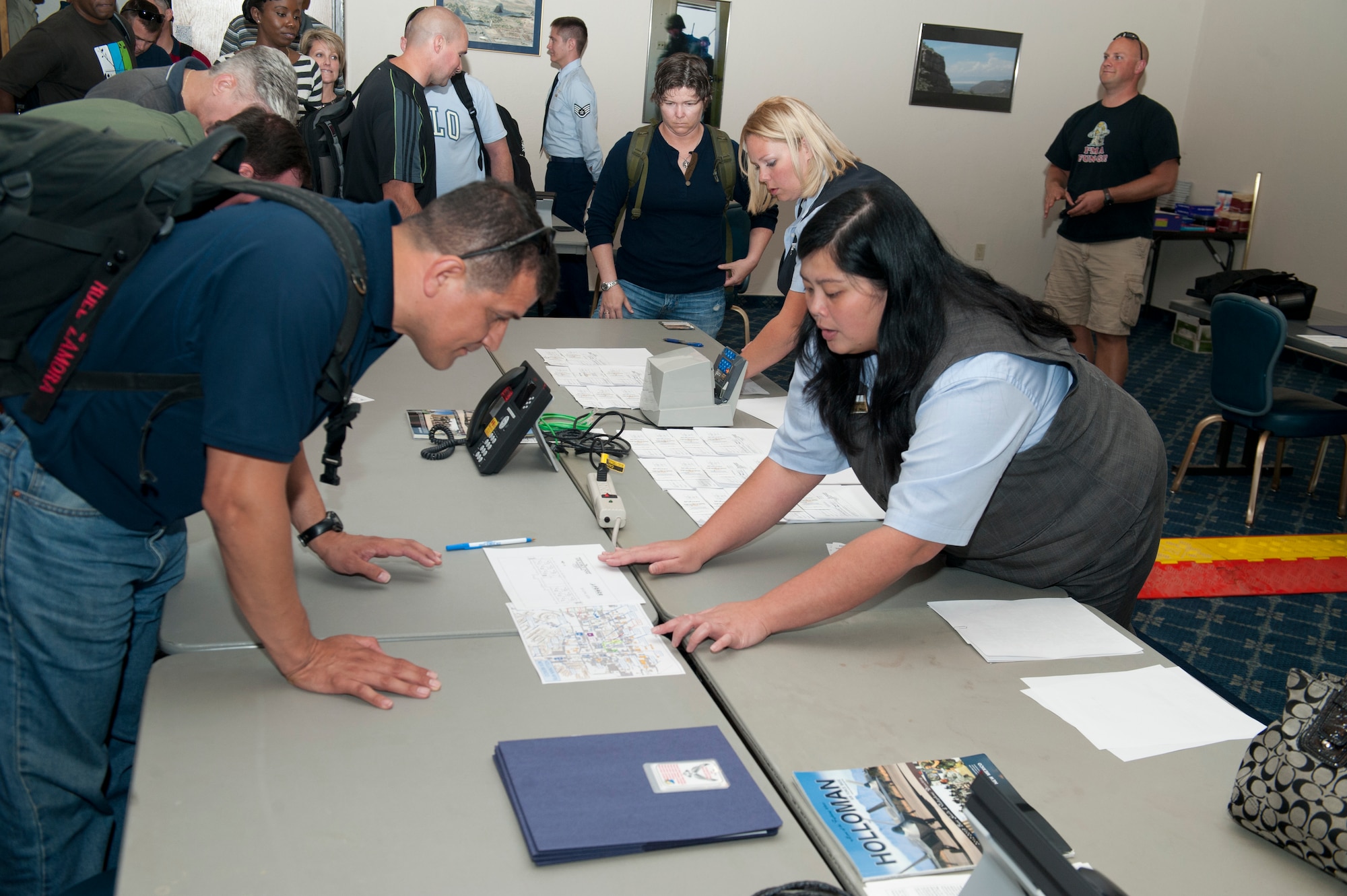 Inspectors sign in at the Desert Sands Enlisted Club to begin the Unit Effectiveness Inspection at Holloman Air Force Base, N.M., Sept. 25.  Holloman AFB is the first base in Air Combat Command to undergo a UEI under the Air Force’s new inspection system, announced under Air Force Instruction 90-201. (U.S. Air Force photo by Airman 1st Class Daniel E. Liddicoet)