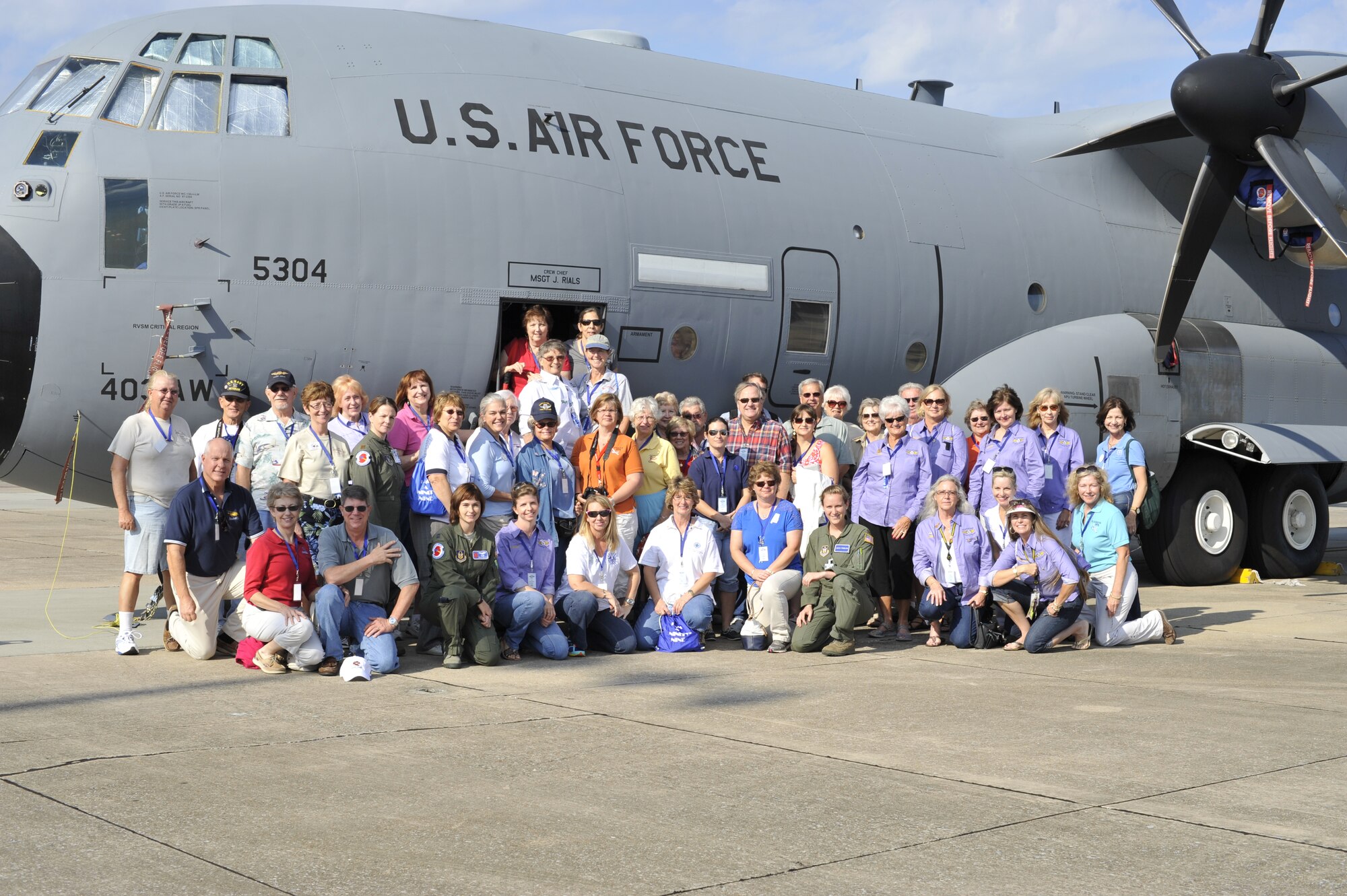Members of the Ninety Nines, a female pilot organization, pose in front of a WC-130J, Hurricane Hunter aircraft during their visit to the 53rd Weather Reconnaissance Squadron at Keesler Air Force Base Sep. 27, 2013.  The tour was given to further educate the Ninety Nines pilots on weather reconnaissance. (U.S. Air Force Photo by Tech. Sgt. Jessica L. Kendziorek)