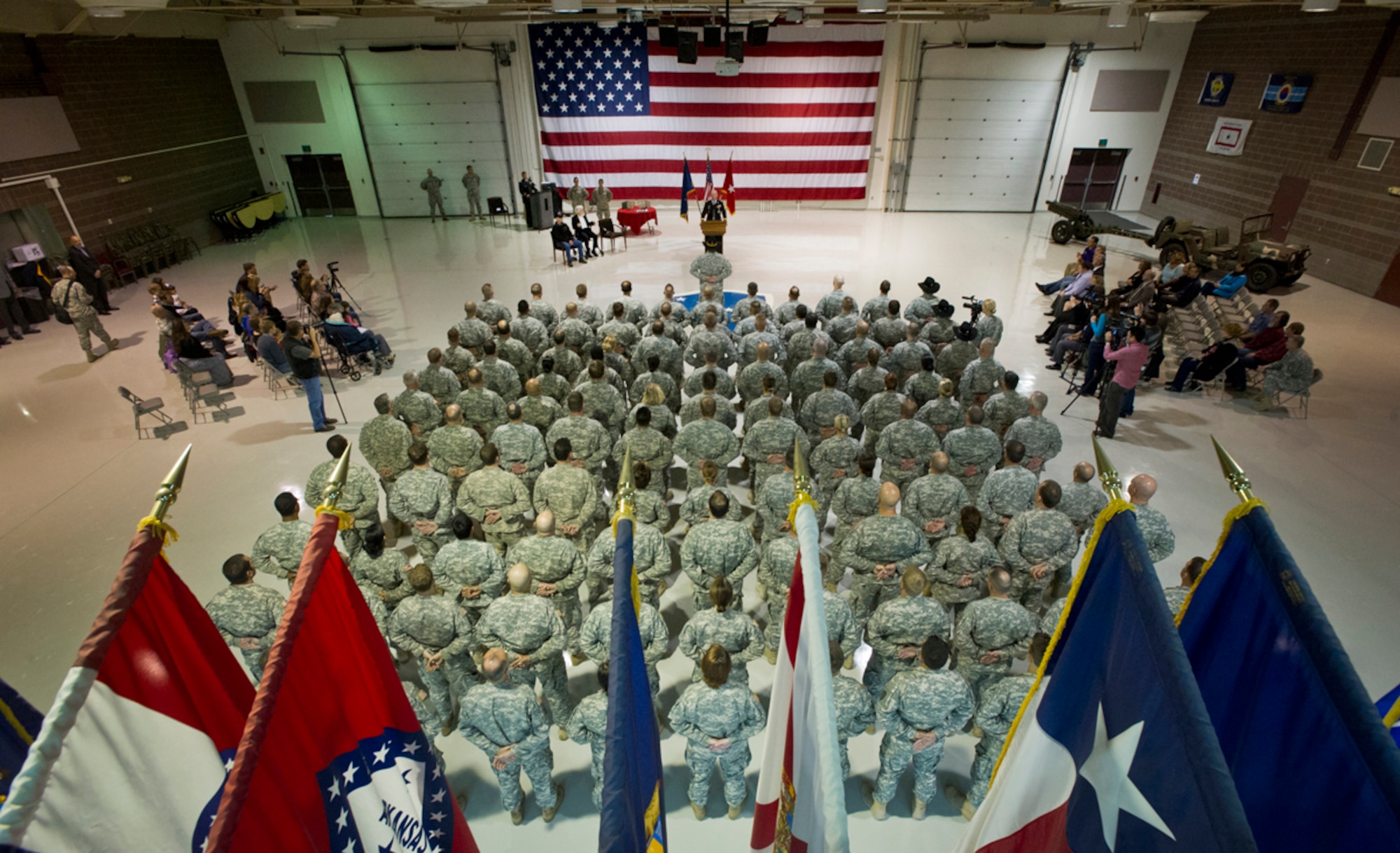 Brig. Gen. Mike Bridges, commander of the Alaska Army National Guard, speaks before awarding World War II veteran Arthur W. Owens the Silver Star and Purple Heart 68 years after his heroic actions while fighting near Ludwigshafen, Germany. On March 23, 1945, Owens' tank was hit by a shell from an anti-tank gun.  After evacuating the vehicle, he returned twice under heavy enemy fire -- and despite his wounds -- to rescue injured comrades. After a review of his records, Secretary of the Army John McHugh recently signed orders to recognize Owens. Brig. Gen. Mike Bridges, commander of the Alaska Army National Guard, presented the medals during a ceremony at the Alaska National Guard headquarters on Joint Base Elmendorf-Richardson, Thursday, Sept. 19, 2013. (U.S. Air Force photo by Justin Connaher/Released)