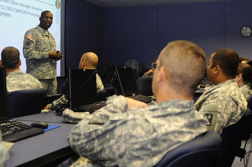 U.S. Army Chief Warrant Officer 5 Brian Taylor, Fort Eustis Warrant Officer Council member, explains the importance of the warrant officer tier during a council meeting at Fort Eustis, Va., Sept. 19, 2013. Warrant officers utilize their expert knowledge to find and solve complicated technical issues within their career fields. (U.S. Air Force photo by Airman 1st Class Austin Harvill/Released)