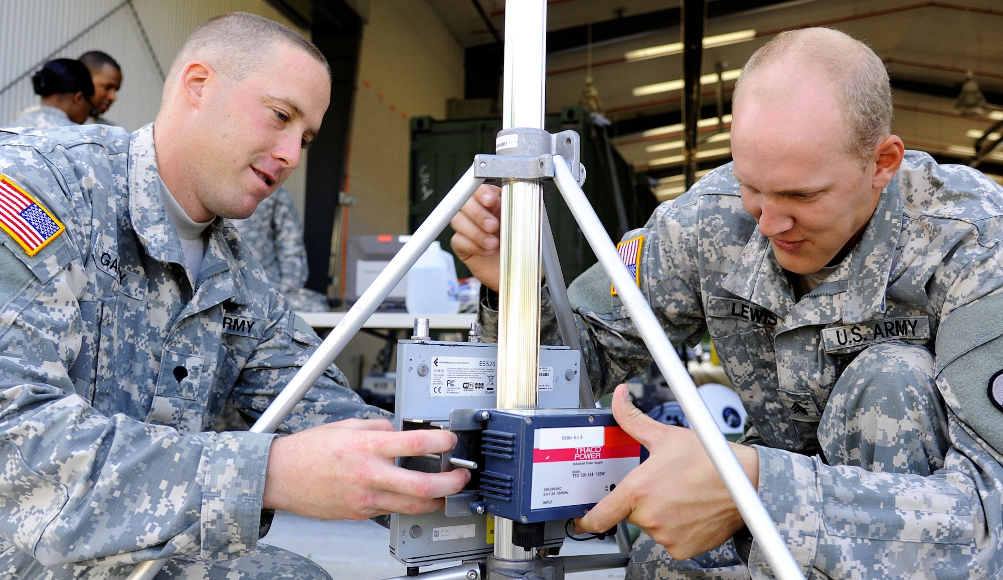 U.S. Army Sgt. Ryan Lewis, 689th Rapid Port Opening Element, 833rd Transportation Battalion movement noncommissioned officer, and Spc. Carl Gahry, 689th RPOE movement specialist, set up a transportation relay system at Fort Eustis, Va., Sept. 12, 2013. Both Lewis and Gahry competed  in the 7th Sustainment Brigade Soldier of the Year competition, and both went on to the next level after placing in the top five at brigade level. (U.S. Air Force photo by Airman 1st Class Austin Harvill/Released)