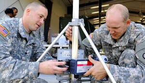 U.S. Army Sgt. Ryan Lewis, 689th Rapid Port Opening Element, 833rd Transportation Battalion movement noncommissioned officer, and Spc. Carl Gahry, 689th RPOE movement specialist, set up a transportation relay system at Fort Eustis, Va., Sept. 12, 2013. Both Lewis and Gahry competed  in the 7th Sustainment Brigade Soldier of the Year competition, and both went on to the next level after placing in the top five at brigade level. (U.S. Air Force photo by Airman 1st Class Austin Harvill/Released)