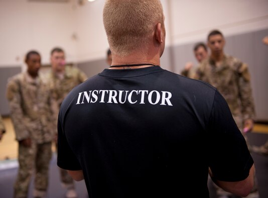 A master combative instructor briefs Tactical Air Control Party candidates before the beginning of their combative skills training at the Aderholt Fitness Center on Hurlburt Field, Fla., Sept. 17, 2013. The candidates went through a five-day combative training course as a part of their technical training. (U.S. Air Force photo/Senior Airman Krystal M. Garrett)