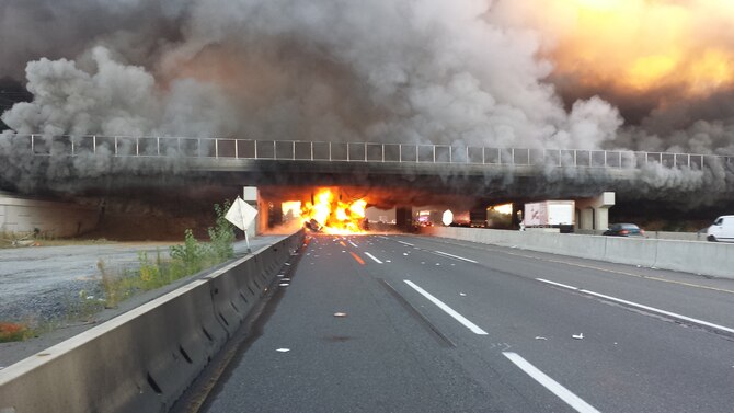 Senior Airman Chad Turko, 714th Aircraft Maintenance Squadron KC-10 crew chief, encountered a fiery accident near exit seven on the New Jersey Turnpike involving an overturned tractor truck and Chevy Silverado while traveling to unit training assembly here Sept. 7. Turko removed the driver of the 18-wheeler that was engulfed in flames shortly after overturning and performed emergency medical care before first responders arrived on the scene. Turko is a registered emergency medical technician and has worked as a firefighter for three years (Courtesy photo/Senior Airman Acdel Tapia).