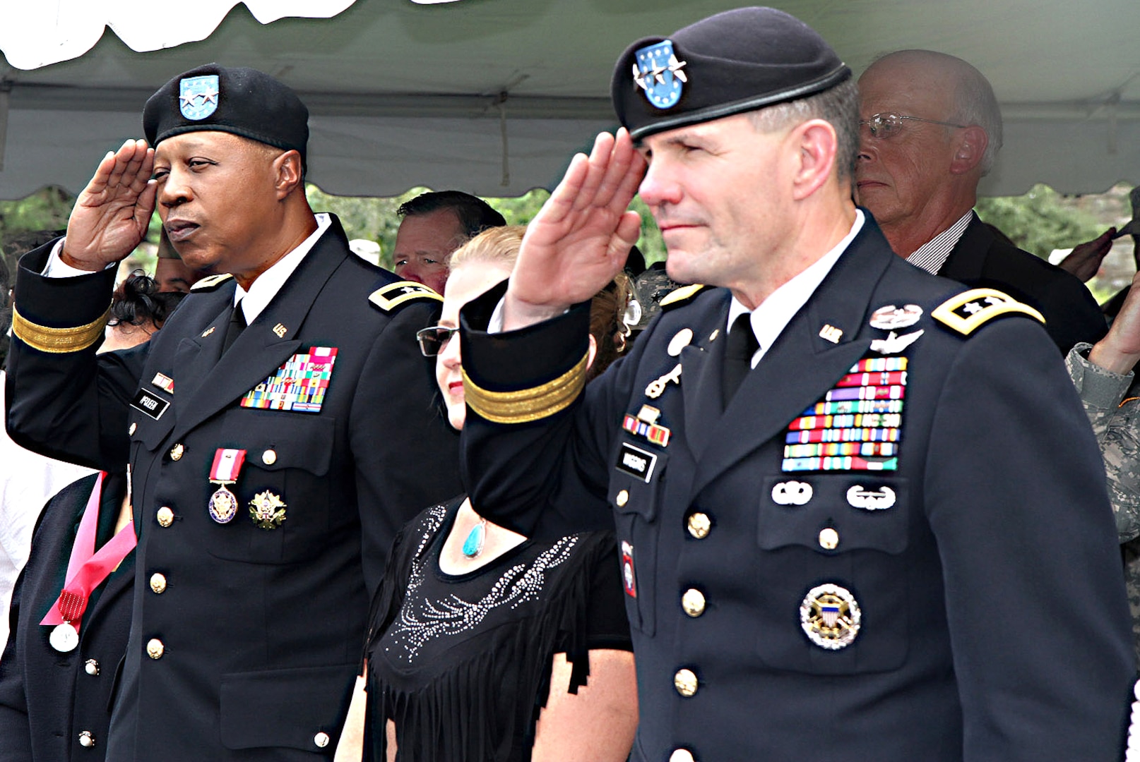 Maj. Gen. Adolph McQueen Jr. (left), deputy commanding general for support, U.S. Army North (Fifth Army), salutes the colors of the nation for the last time alongside Lt. Gen. Perry Wiggins, commanding general for Army North and senior Army commander for Fort Sam Houston and Camp Bullis, during his retirement ceremony Sept. 17 in the historic Quadrangle. McQueen enlisted in the U.S. Marine Corps in 1971 and was directly commissioned into the Michigan National Guard in 1982. (Photo by Staff Sgt. Corey Baltos, U.S. Army North Public Affairs)