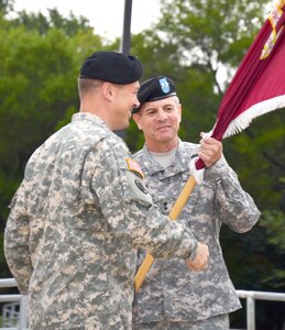 Maj. Gen. Steve Jones (right), incoming commanding general for the Army Medial Department Center and School, smiles as he accepts the colors from Maj. Gen. Brian Lein, Army deputy surgeon general and deputy commanding general  for operations, U.S. Army Medical Command, at a change of command ceremony Sept. 19 at the Army Medical Department Museum. (Photo by Esther Garcia, U.S. Army Medical Department Center and School Public Affairs)