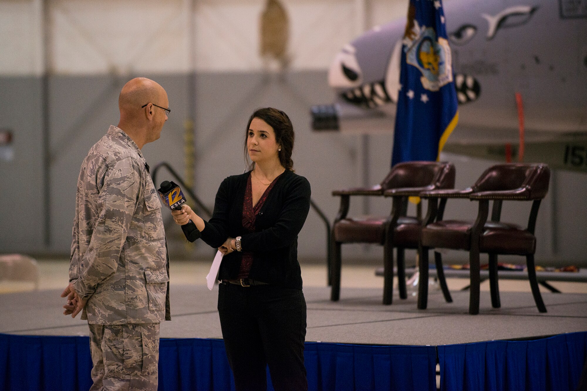 U.S. Air Force Lt. Col. Travis Caughlin, 917th Fighter Group (FG) deputy commander of maintenance, is interviewed by Olivia Dival, KSLA Channel 12 news reporter, prior to an Inactivation Ceremony, Sept. 26, 2013, Barksdale Air Force Base, La. The 917th fell victim to military defense cuts and was inactivated after a 50 year history at Barksdale. (U.S. Air Force photo by Master Sgt. Greg Steele/Released)