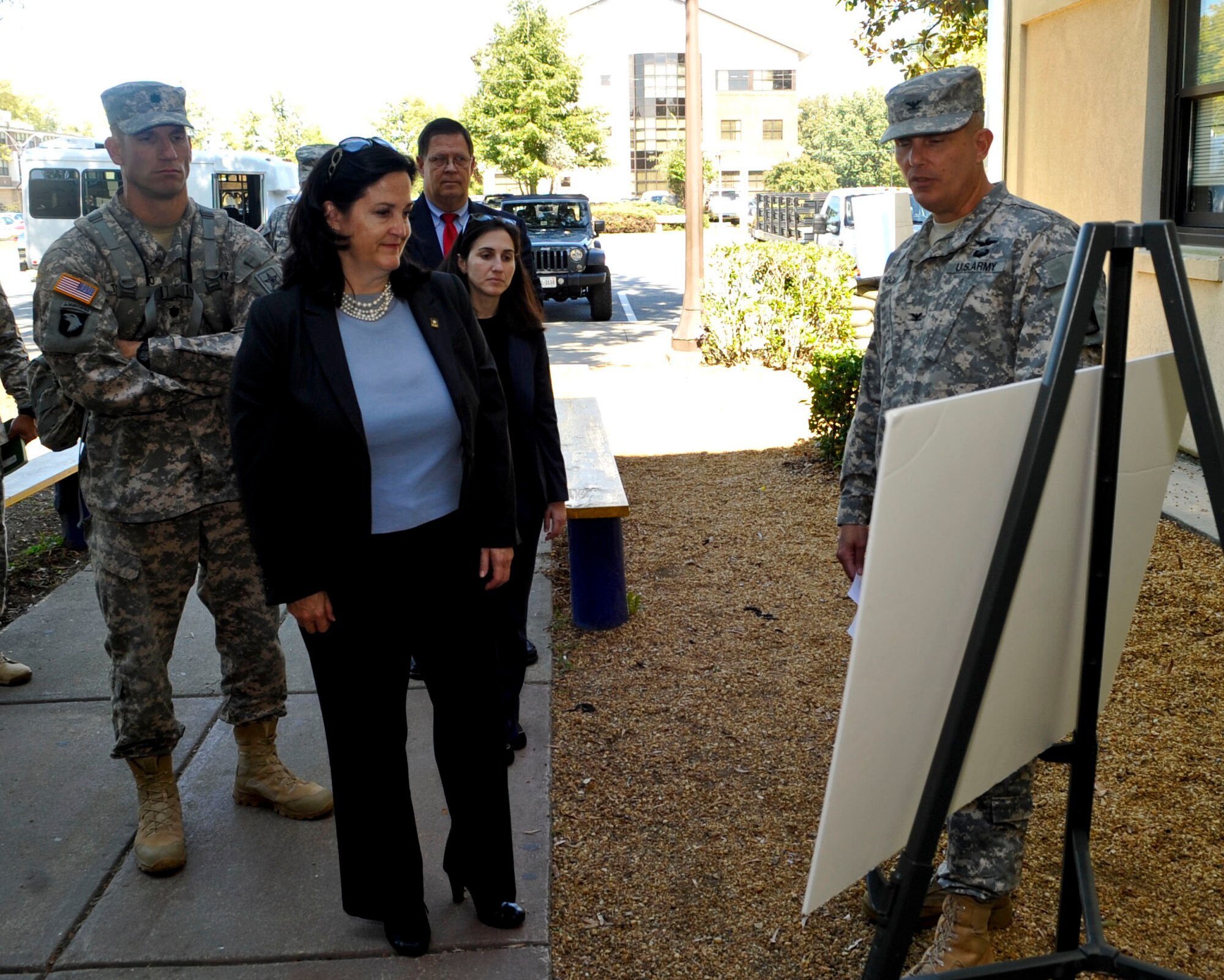 Katherine Hammack, Assistant Secretary of the Army for Installations, Energy & Environment, is briefed by U.S. Army Col. Julis Rigole 128th Aviation Brigade commander, about the unit’s mission at Fort Eustis, Va., Sept. 25, 2013. Hammack also talked with Soldiers about their experiences and toured 3rd Port to discuss the Army’s maritime capabilities. (U.S. Air Force photo by Staff Sgt. Wesley Farnsworth/Released)