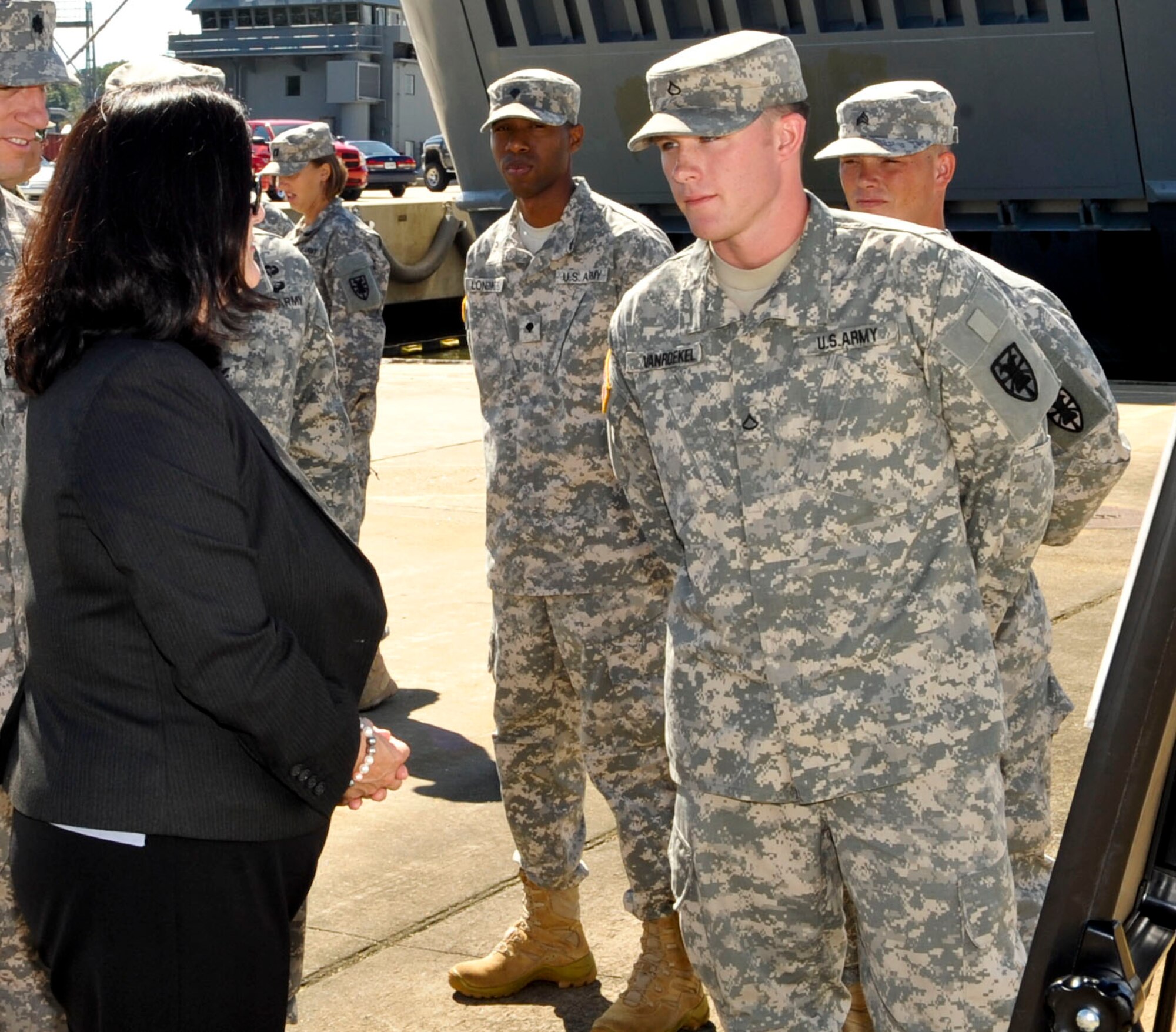 Katherine Hammack, Assistant Secretary of the Army for Installations, Energy & Environment, receives a brief from U.S. Army Pfc. Ashton Vanroekeh, 1098th Transportation Detachment Landing Craft Mechanized 8594 Mod II deckhand, about the vessel’s capabilities during a tour at Fort Eustis, Va., Sept. 25, 2013. Hammack toured many vessels during her visit to 3rd Port and discussed the Army’s maritime capabilities with Soldiers. (U.S. Air Force photo by Staff Sgt. Wesley Farnsworth/Released)