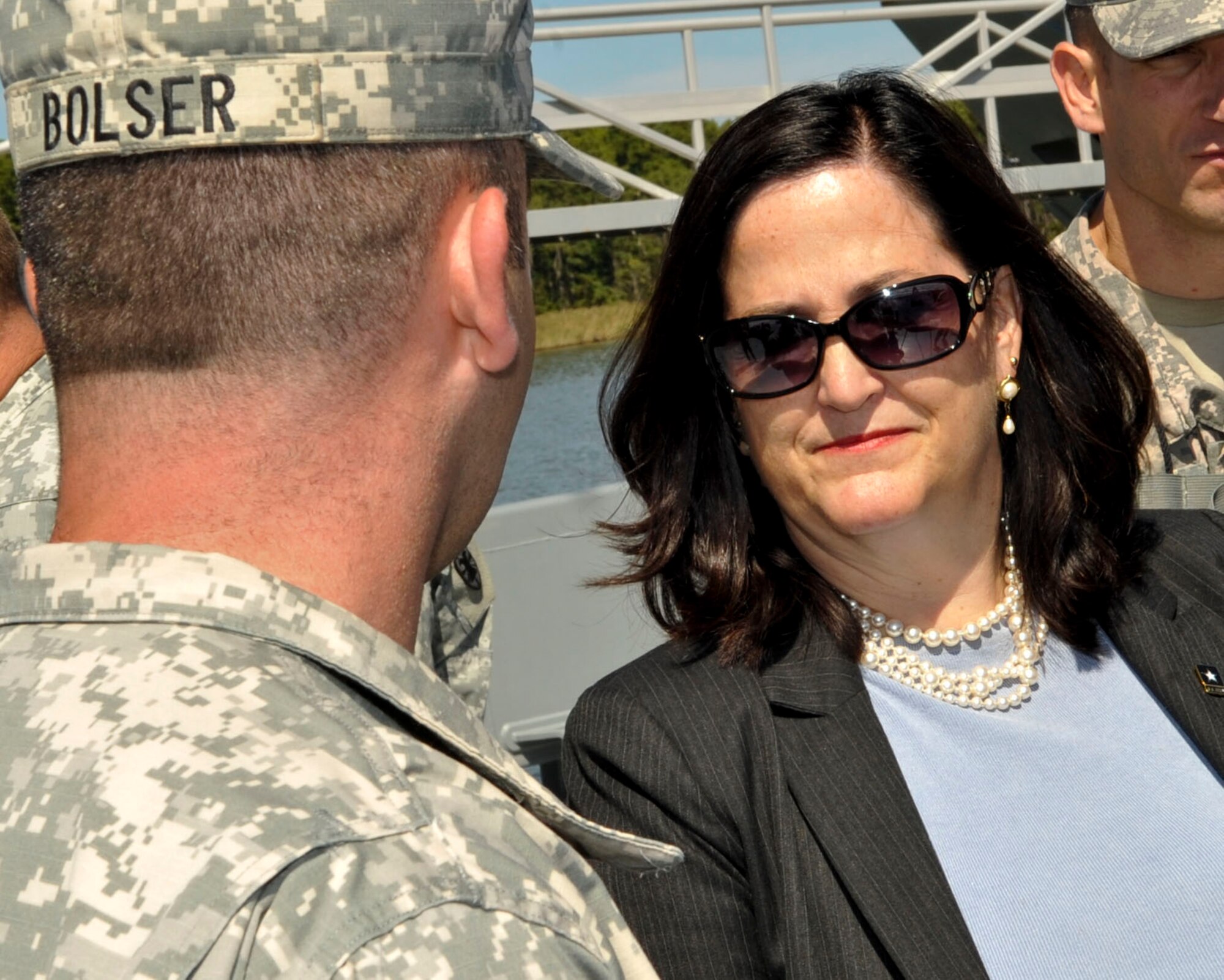 Katherine Hammack, Assistant Secretary of the Army for Installations, Energy & Environment, receives a brief from U.S. Army Chief Warrant Officer 2 Gary Bolser, 97th Transportation Company Landing Craft Utility 2000 vessel master, about the capabilities of his vessel during a tour at Fort Eustis, Va., Sept. 25, 2013. Hammack visited several locations, talked to Soldiers about their jobs and toured post facilities. (U.S. Air Force photo by Staff Sgt. Wesley Farnsworth/Released)
