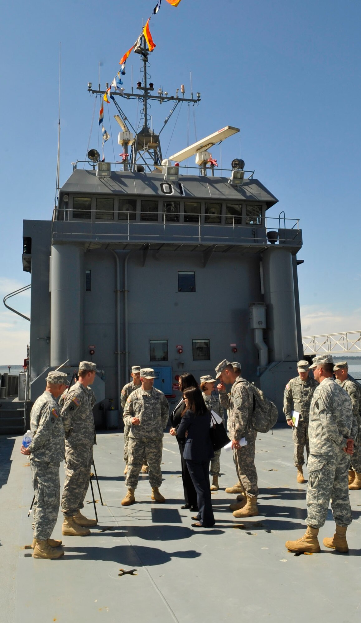 Members of the 9th Transportation Company brief Katherine Hammack, Assistant Secretary of the Army for Installations, Energy & Environment, about the capabilities of the Landing Craft Utility 2000 vessel in 3rd Port at Fort Eustis, Va., Sept. 25, 2013. During Hammack’s visit, she met with leadership and Soldiers, toured barracks and saw the Soldiers’ training areas. (U.S. Air Force photo by Staff Sgt. Wesley Farnsworth/Released)