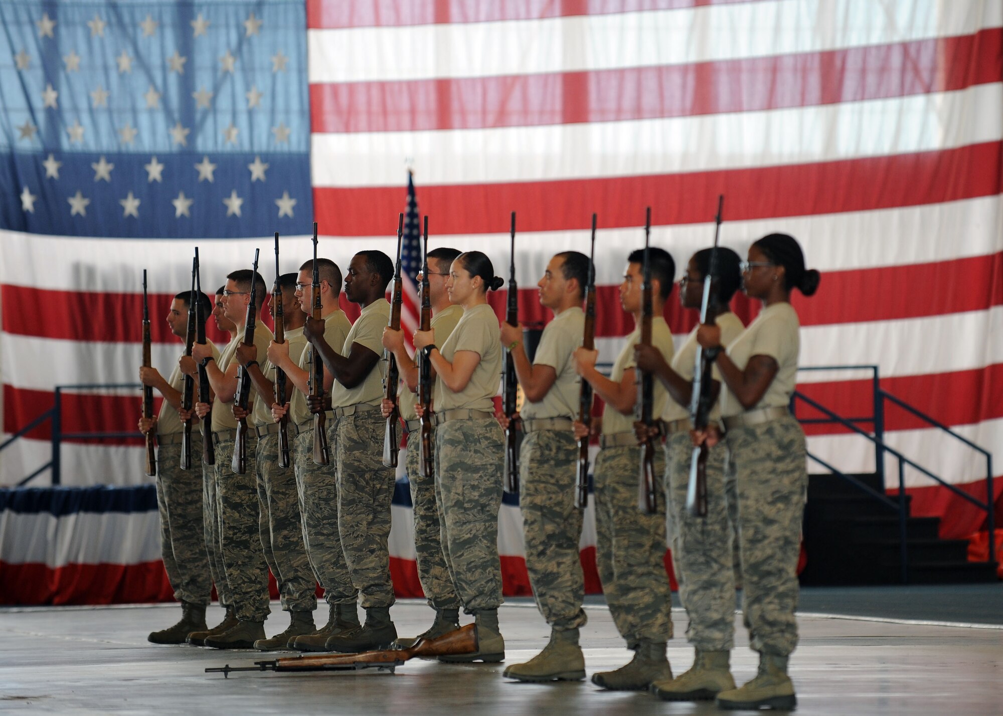 Ellsworth Honor Guard trainees learn how to perform a firing party drill during training in the Pride Hangar at Ellsworth Air Force Base, S.D. Sept. 19, 2013. The firing party ceremonial tradition dates back to the Civil War, and consists of three volleys fired to symbolize the removal of deceased bodies from the battlefield. (U.S. Air Force photo by Airman 1st Class Rebecca Imwalle/Released)