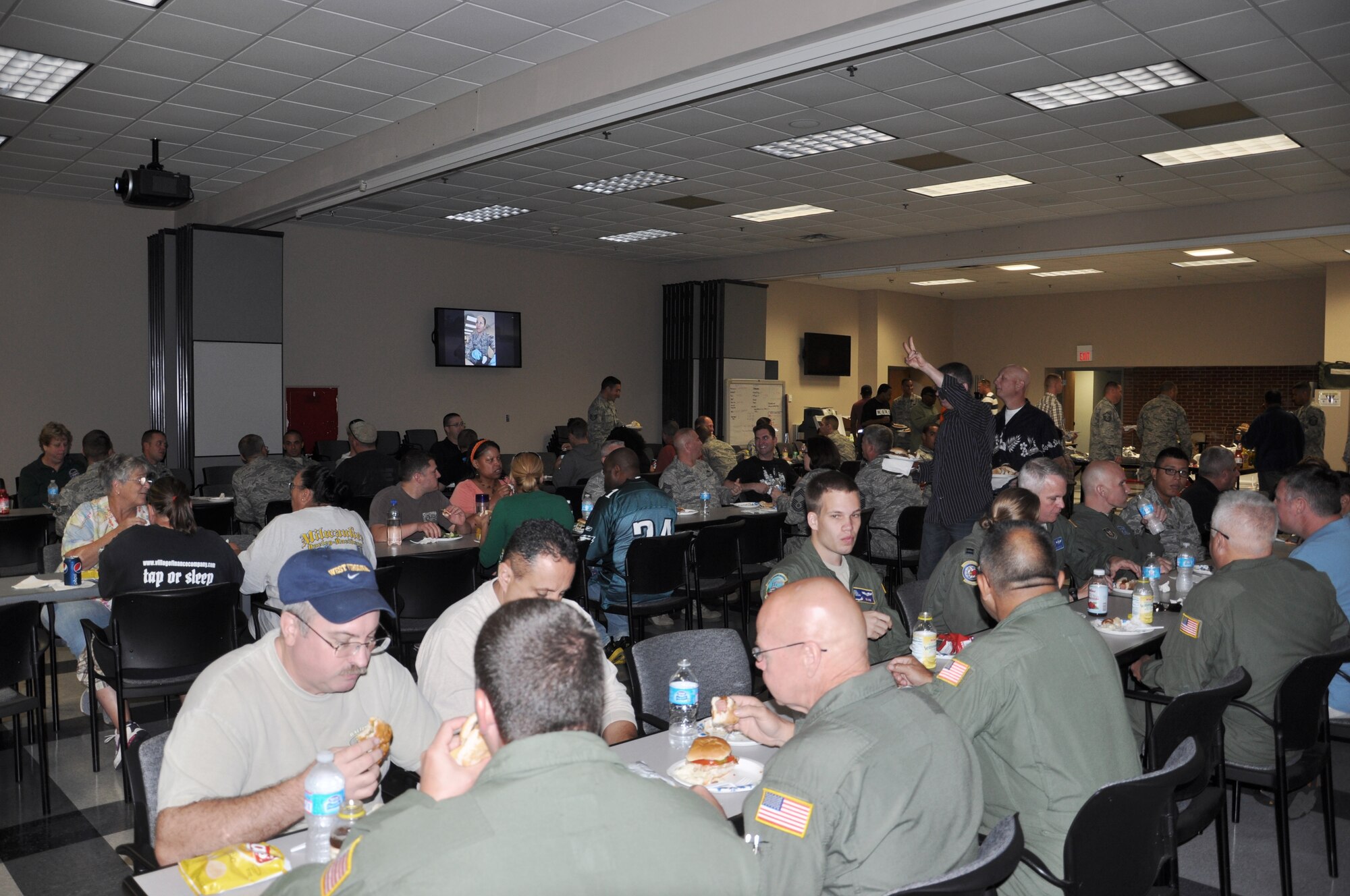 Several 514th Air Mobility Wing service members, civilian personnel and Air Reserve Technicians enjoyed a congratulatory barbeque lunch to celebrate Hot Diggity Dog Day held here Sept. 26. For more than two hours, attendees mixed and mingled over hot dogs and hamburgers celebrating their achievements for the 2013 fiscal year (U.S. Air Force photo/Senior Airman Chelsea Smith).