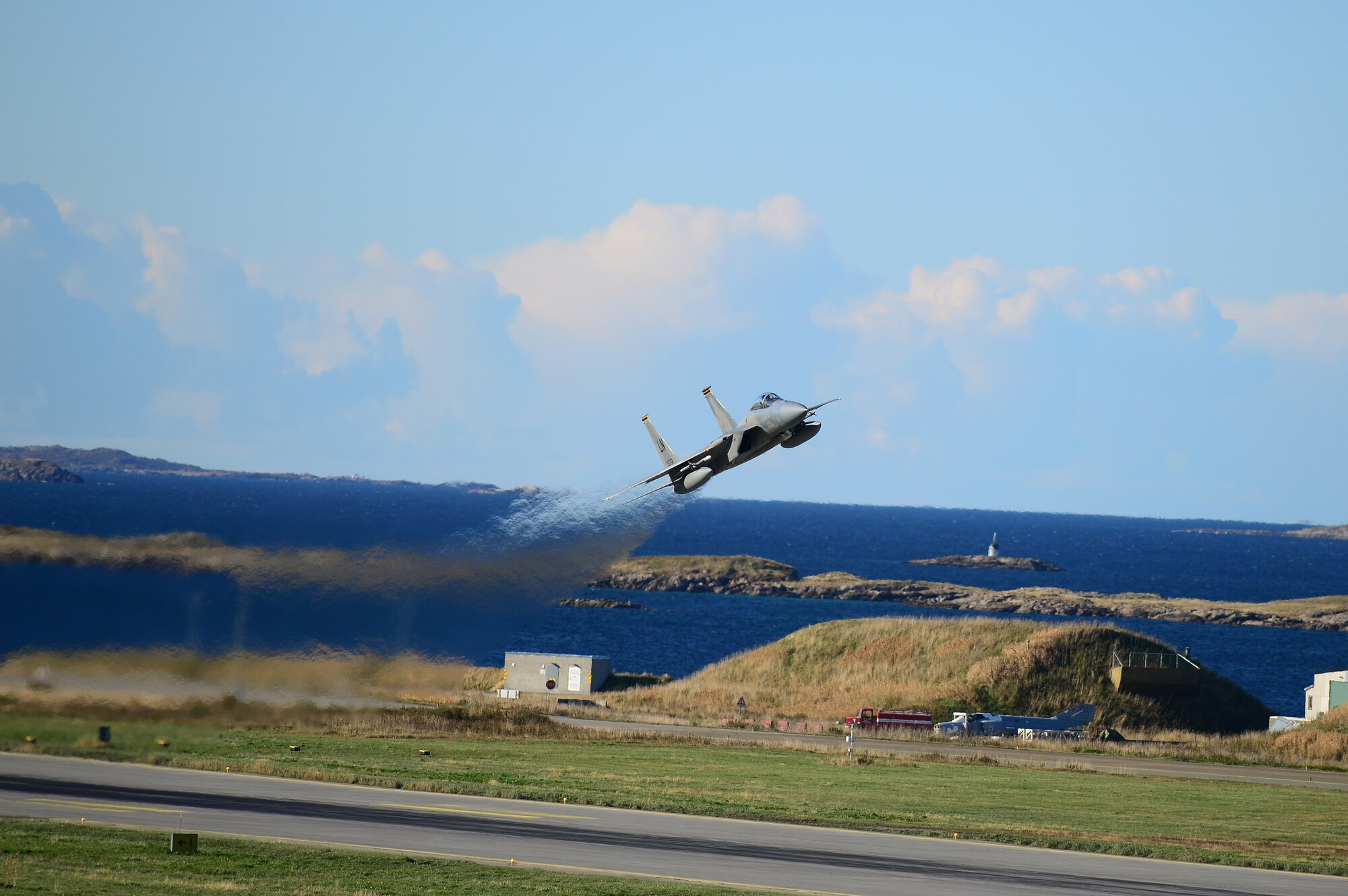 An F-15E Strike Eagle assigned to the 494th Fighter Squadron flies above Bodø Main Air Station, Norway, Sept. 24, 2013. Approximately 30 aircraft deployed from RAFs Lakenheath and Mildenhall, to multiple locations in Norway in support of the Arctic Challenge Exercise 2013. ACE-13 was a combined exercise with NATO and regional allies, which promoted continued interoperability between the United States, Norway, Sweden, Finland, United Kingdom and NATO. (U.S. Air Force photo by Master Sgt. Lee Osberry/Released)