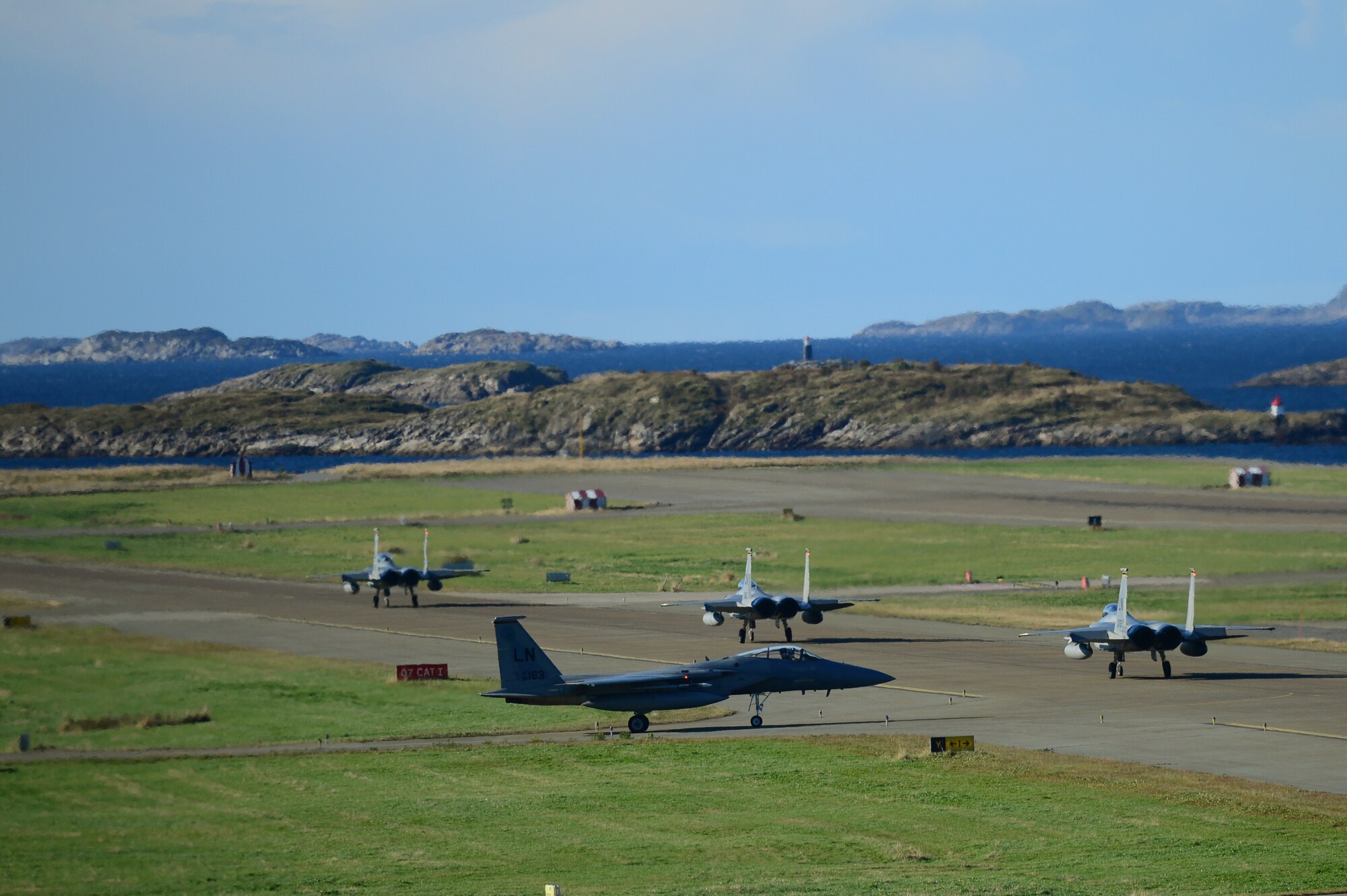 A group of F-15E Strike Eagles and F-15C Eagles, prepare to depart, on an exercise mission from Bodø Main Air Station, Norway, Sept. 24, 2013. Approximately 30 aircraft deployed from RAFs Lakenheath and Mildenhall, to multiple locations in Norway, in support of the Arctic Challenge Exercise 2013. ACE-13 was a combined exercise with NATO and regional allies, which promoted continued interoperability between the United States, Norway, Sweden, Finland, United Kingdom and NATO. (U.S. Air Force photo by Master Sgt. Lee Osberry/Released)