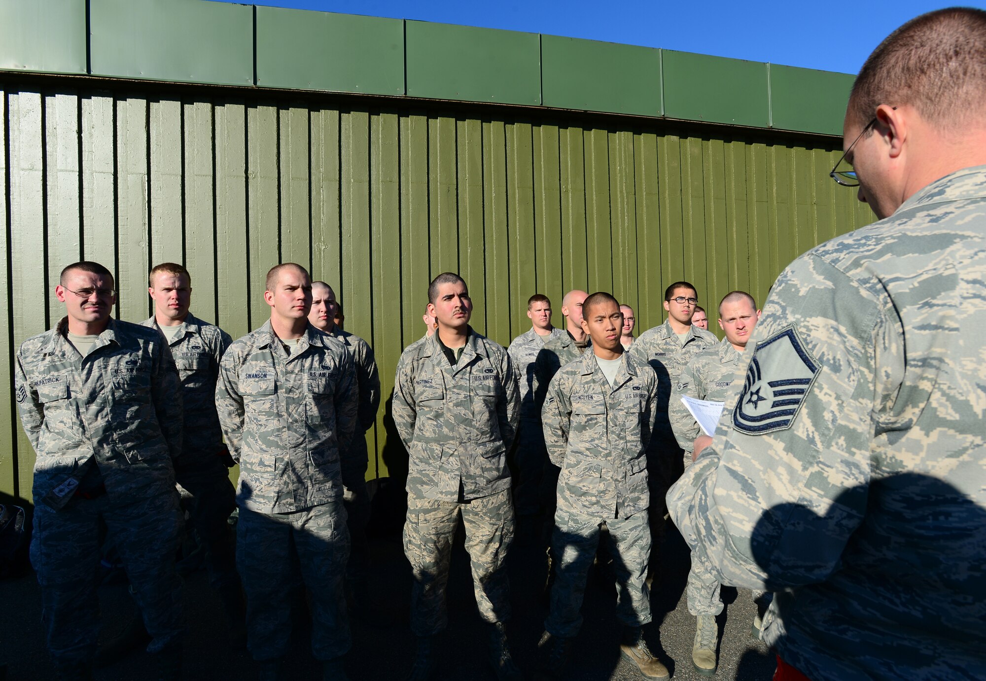 Master Sgt. Patrick Robinson, 48th Aircraft Maintenance Squadron aircraft section chief, passes on information during roll-call at Bodø Main Air Station, Norway, Sept. 24, 2013. Robinson was amongst approximately 600 personnel deployed from multiple bases within U.S. Air Forces in Europe-Air Forces Africa, supporting the Arctic Challenge Exercise 2013. ACE-13 was a combined exercise with NATO and regional allies, which promoted continued interoperability between the United States, Norway, Sweden, Finland, United Kingdom and NATO. (U.S. Air Force photo by Master Sgt. Lee Osberry/Released) 