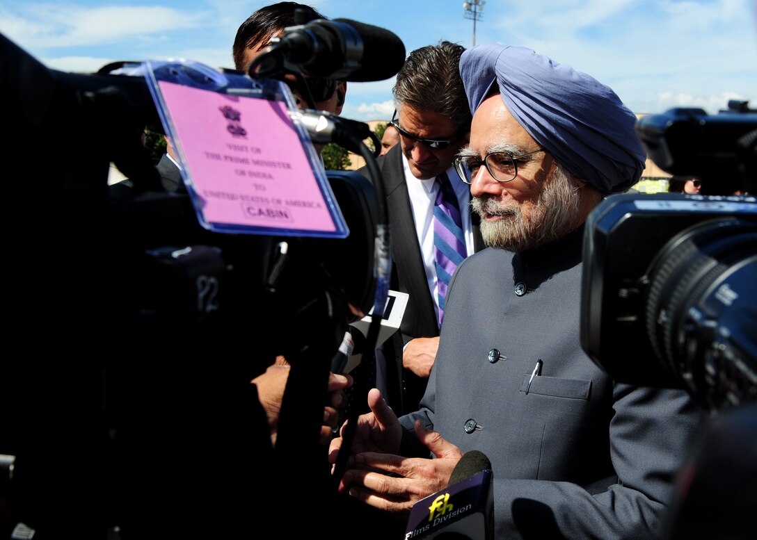 Prime of India Dr. Manmohan Singh speaks to media after arriving to Joint Base Andrews, Md., Sept. 26, 2013. The Prime Minister arrived for a two-day visit to meet with President Barack Obama and First Lady Michelle Obama. The Prime Minister was accompanied by his wife Gursharan Kaur and was welcomed by U.S. State Department?s Acting Deputy Chief of Protocol Rosemarie Pauli. (U.S. Air Force photo/Staff Sgt. Nichelle Anderson)
