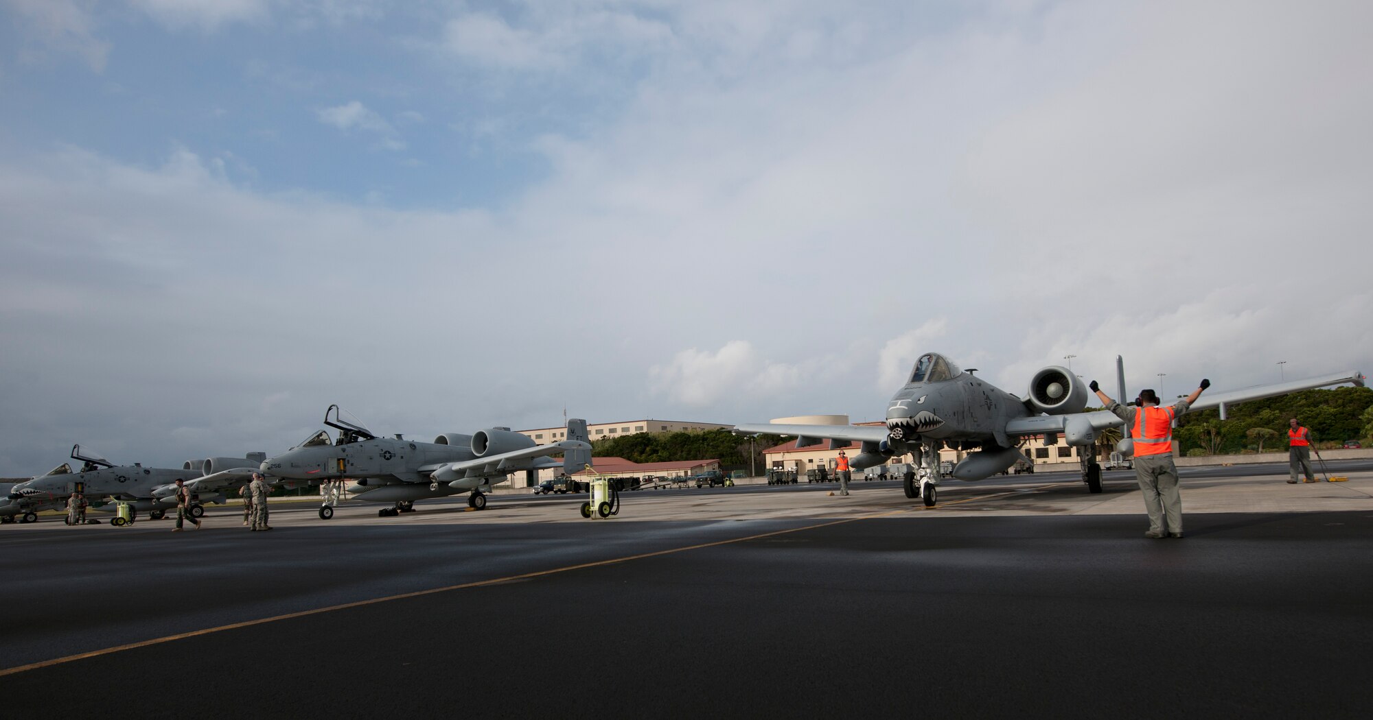 The 65th Operations Support Squadron transient alert team marshal A-10 Thunderbolts at Lajes Field, Azores, Sept. 24, 2013. The team will perform post operation checks and refuel the aircraft, which arrived from the 75th Fighter Squadron on Moody Air Force Base, Ga. (U.S. Air Force photo by Tech. Sgt. Paul Villanueva II/Released)
