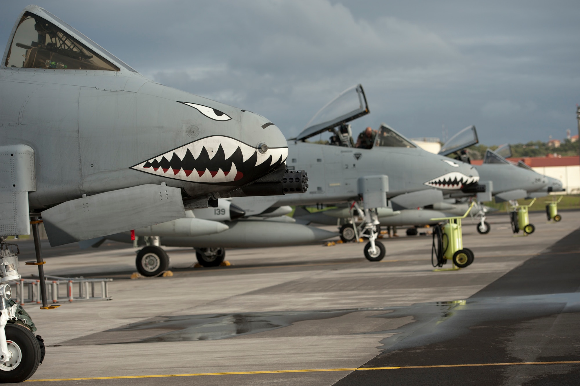 A-10 Thunderbolt II's are parked along a ramp at Lajes Field, Azores, Sept. 24, 2013. The 65th Operations Support Squadron transient alert team will refuel the aircraft and do post flight checks to ensure they remain operational. The aircraft are from the 75th Fighter Squadron, Moody Air Force Base, Ga.(U.S. Air Force photo by Tech. Sgt. Paul Villanueva II/Released)