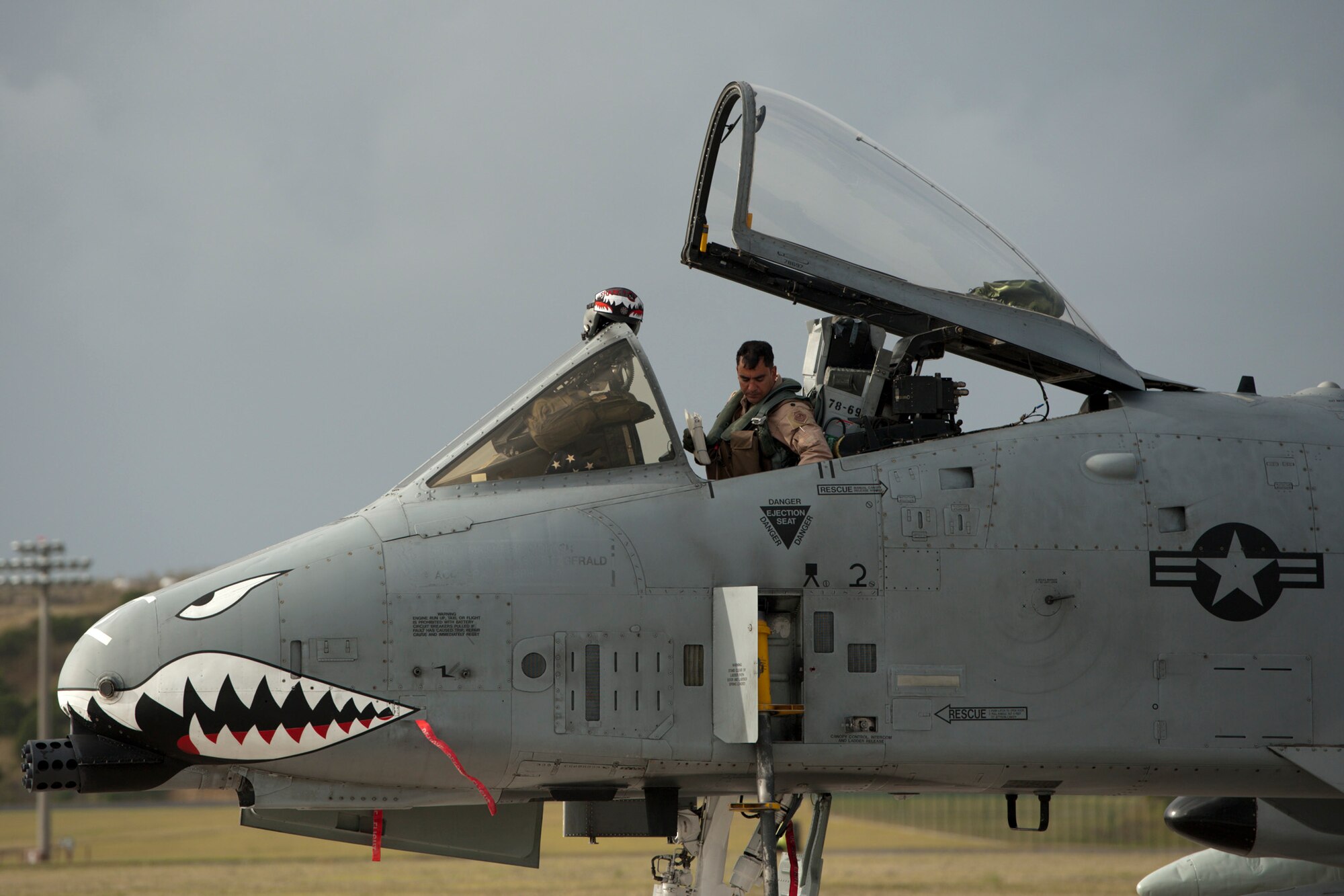 U.S. Air Force Lt. Col. David Rayman, 75th Fighter Squadron commander, prepares to disembark his A-10 Thunderbolt II Sept. 24, 2013, at Lajes Field, Azores. The 65th Operations Support Squadron transient alert team will refuel the aircraft and do post operational checks to ensure they remain operational. (U.S. Air Force photo by Tech. Sgt. Paul Villanueva II/Released)