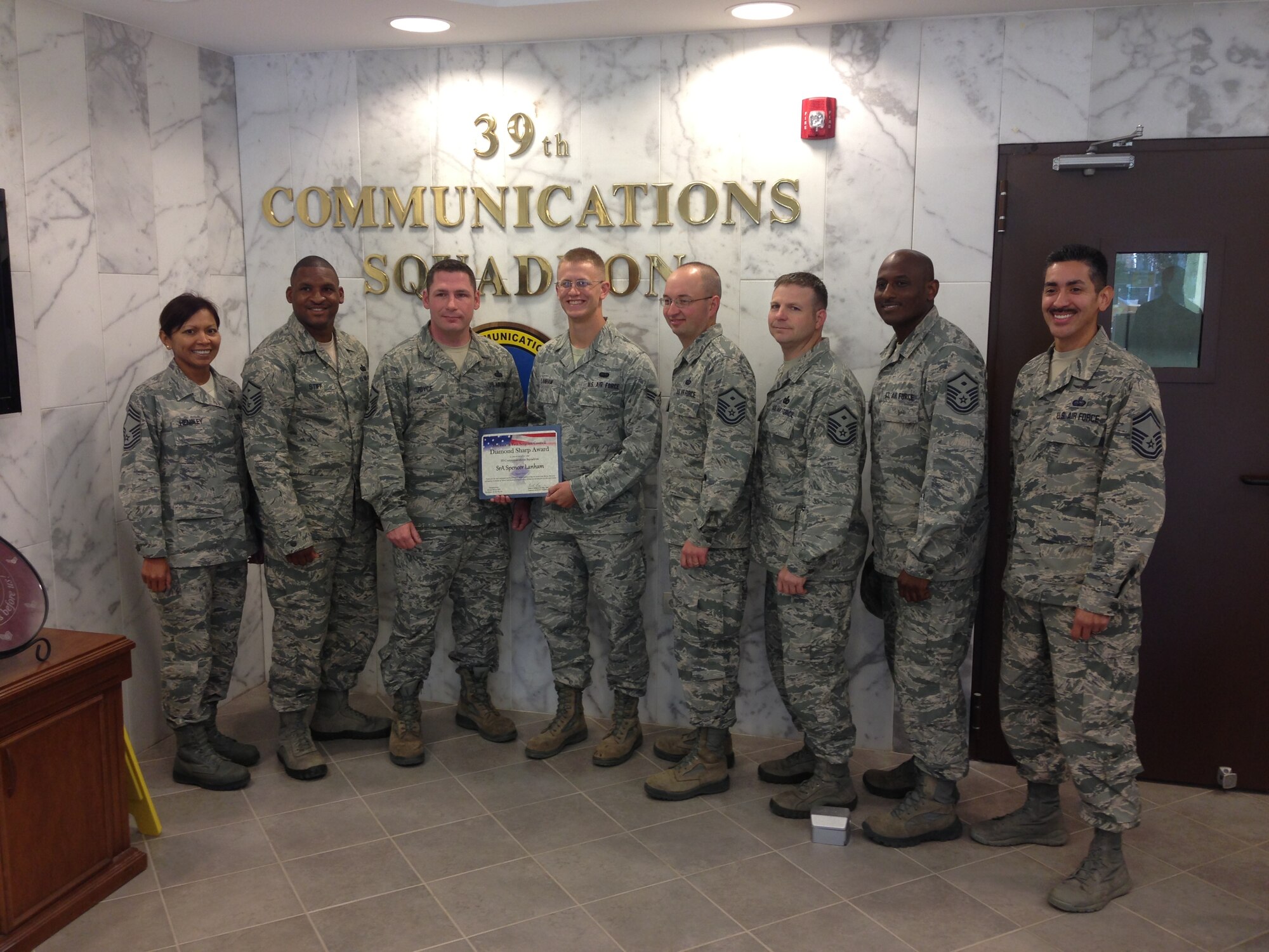 Senior Airman Spencer Lanham, 39th Communications Squadron radio frequency transmission technician, was recognized as the August Diamond Sharp Award winner by the Incirlik First Sergeant's Council in front of members of the 39th CS Sept. 10, 2013, at Incirlik Air Base, Turkey. Lanham volunteered to set up an electrostatic discharge protected table that was previously identified as not in compliance and provided training for multiple members of the 39th Logistics Readiness Squadron, arming the members for a performance evaluation, which was noted as "perfect" by one inspector during the Logistics Compliance Assessment Program. (Courtesy photo/Released)