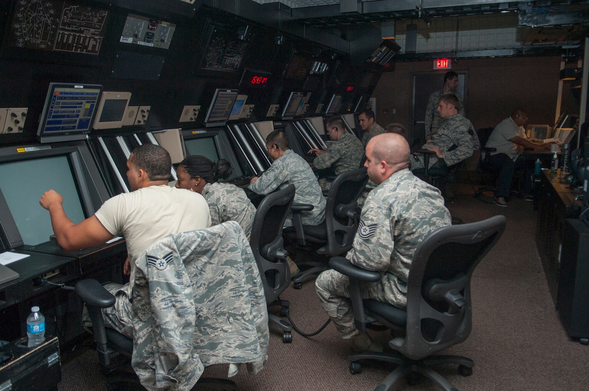 Air traffic controllers observe radar displays at Moody Air Force Base, Ga., Sept. 19, 2013. ATCs use information about aircraft’s position and flight conditions to direct air traffic. (U.S. Air Force photo by Airman 1st Class Sandra Marrero/Released)
