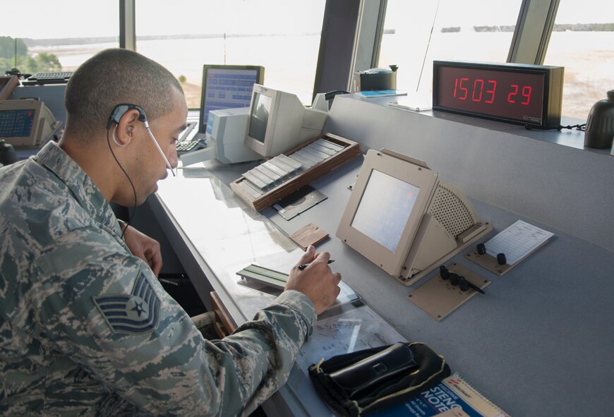 U.S. Air Force Tech. Sgt Joshua Lynch, 23d Operations Support Squadron air traffic control journeyman, updates the Automatic Terminal Information Service at Moody Air Force Base, Ga., Sept. 19, 2013. Pilots use the service to listen to information about temperature, cloud level, and airfield conditions. (U.S. Air Force photo by Airman 1st Class Sandra Marrero/Released)
