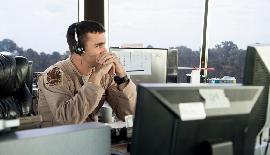 U.S. Air Force Capt. Chad Rudolph, 23d Operations Support Squadron supervisor of flying checks for landing aircraft at the tower at Moody Air Force Base, Ga., Sept. 19, 2013. Airmen working at Moody’s tower are responsible for the safety of pilots and aircraft within a five-mile radius of the Moody AFB tower. (U.S. Air Force photo by Airman 1st Class Sandra Marrero/Released). 