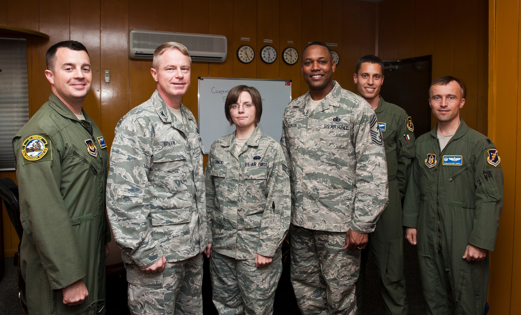 Senior Airman Ashley Janicki, 39th Expeditionary Operations Group commander’s executive assistant, receives a coin from Col. Brent Bigger, 39th Air Base Wing vice commander, after being recognized for her exceptional performance Sept. 25, 2013, at Incirlik Air Base, Turkey. "Pick of the 'Lik’" recognizes outstanding members of Team Incirlik who display a commitment to excellence. Airmen are nominated by their squadron supervision and selected by 39th Air Base Wing senior leadership for recognition. (U.S. Air Force photo by Senior Airman Daniel Phelps/Released)