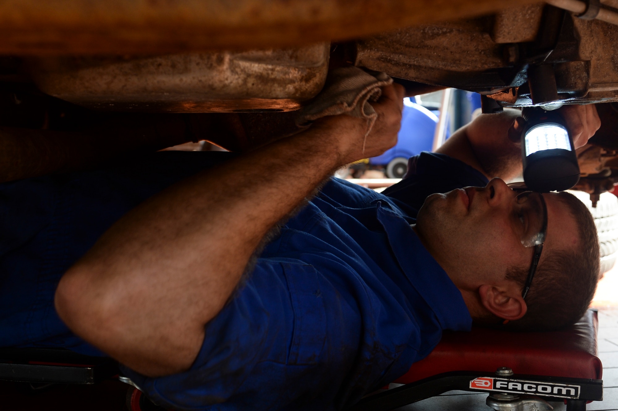 SPANGDAHLEM AIR BASE, Germany--U.S. Air Force Staff Sgt. Richard Seyler, 52nd Logistics Readiness Squadron vehicle maintenance technician from Port Republic, N.J., inspects transmission output and a seal on a truck at the vehicle maintenance shop, Sept. 25, 2013. Seyler inspected the transmission output and seal as a part of a mandatory annual inspection for government-owned vehicles. (U.S. Air Force photo by Senior Airman Rusty Frank/Released)  