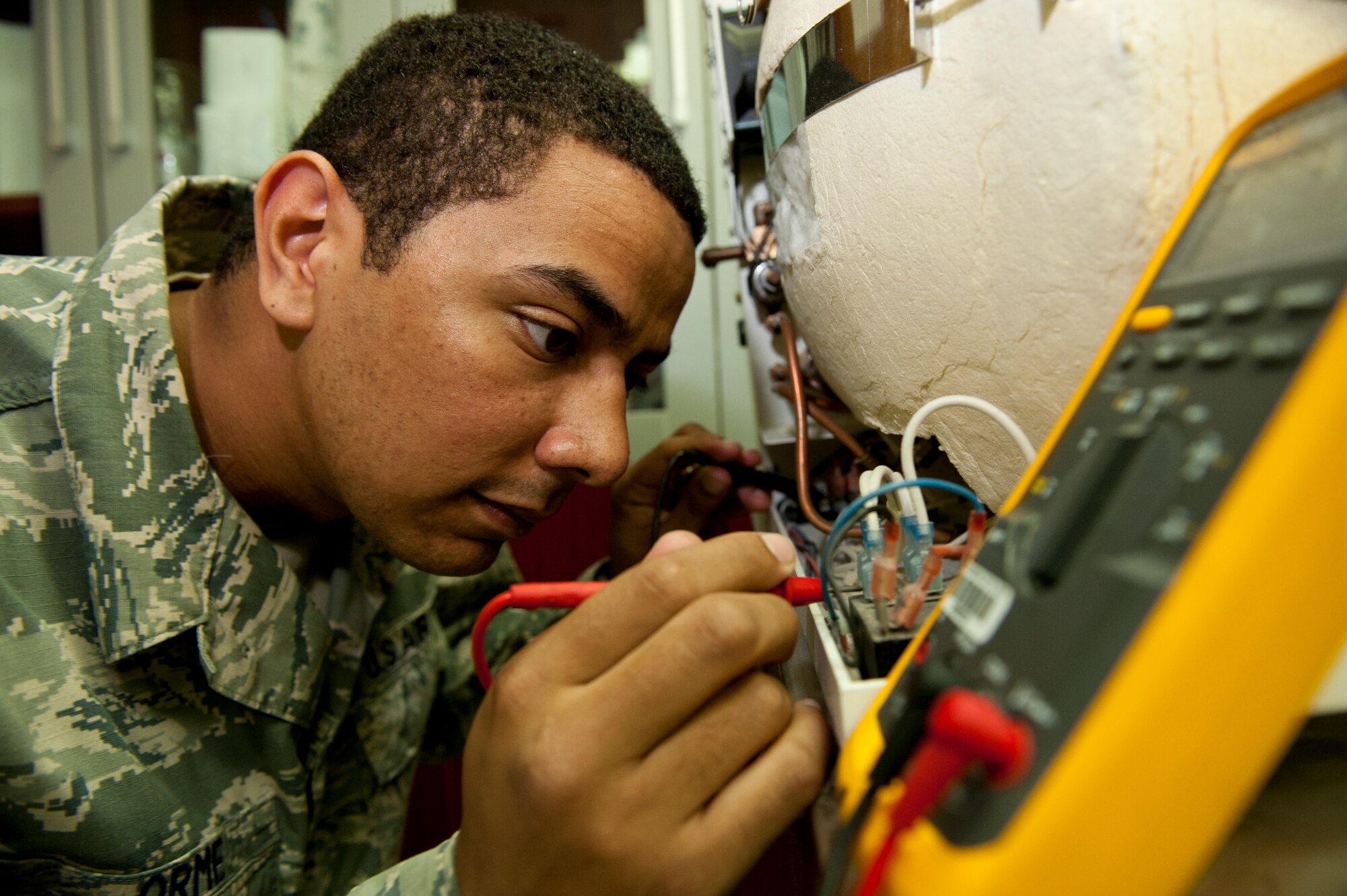 U.S. Air Force Staff Sgt. Anthony Orme, 380th Expeditionary Medical Group biomedical maintenance equipment technician, checks for an electric current on a sterilizer at an undisclosed location in Southwest Asia Sept. 25, 2013. Orme ensures all medical equipment in the 380th EMDG is in working order to prevent patient care deficiencies. Orme is native to Weirton, W.Va., and is deployed from Tyndall Air Force Base, Fla. (U.S. Air Force photo by Staff Sgt. Joshua J. Garcia)