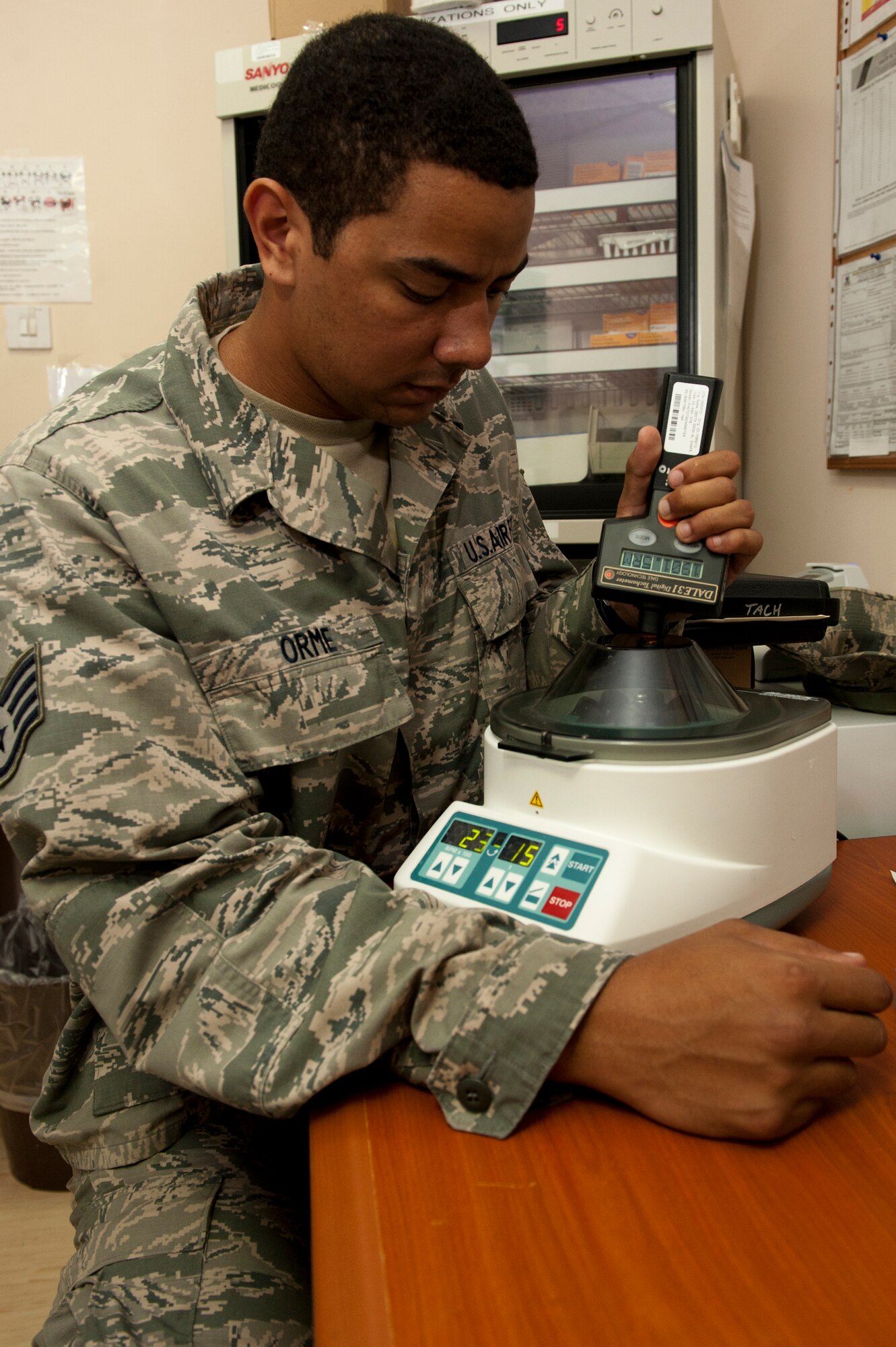 U.S. Air Force Staff Sgt. Anthony Orme, 380th Expeditionary Medical Group biomedical maintenance equipment technician, verifies the rotations per minute of a centrifuge at an undisclosed location in Southwest Asia Sept. 25, 2013. Orme maintains all medical equipment in the 380th EMDG. Orme is native to Weirton, W.Va., and is deployed from Tyndall Air Force Base, Fla. (U.S. Air Force photo by Staff Sgt. Joshua J. Garcia)