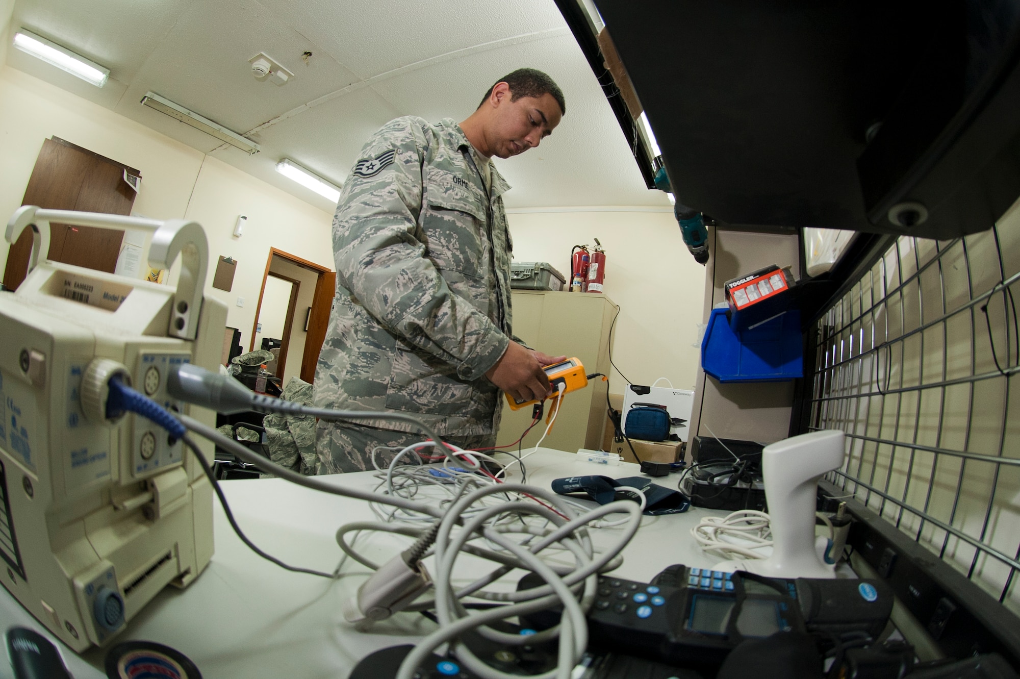 U.S. Air Force Staff Sgt. Anthony Orme, 380th Expeditionary Medical Group biomedical maintenance equipment technician, calibrates a heart monitor at an undisclosed location in Southwest Asia Sept. 25, 2013. Orme is native to Weirton, W.Va., and is deployed from Tyndall Air Force Base, Fla. (U.S. Air Force photo by Staff Sgt. Joshua J. Garcia)