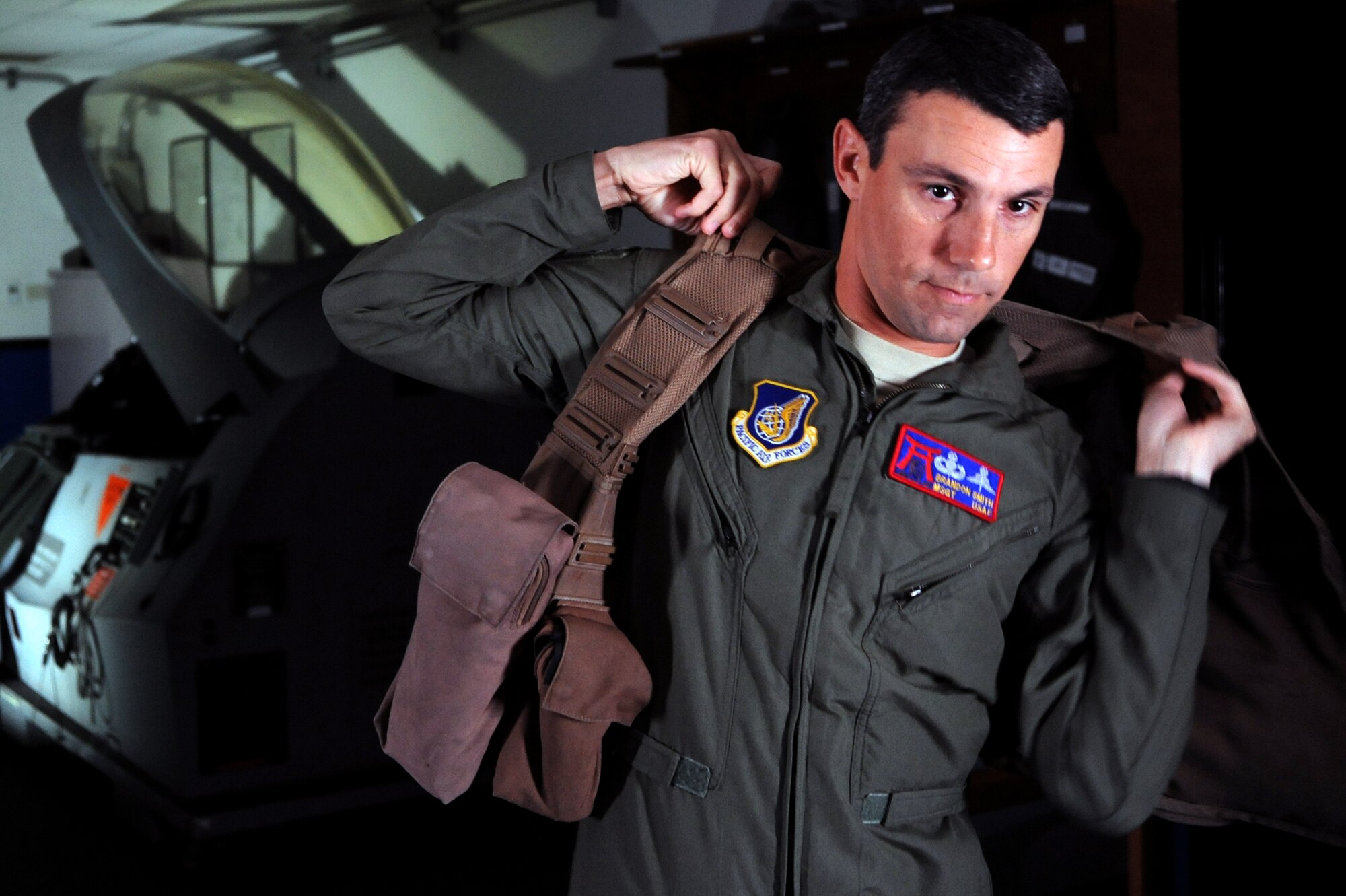 Master Sgt. Frank Smith, superintendent of the 35th Fighter Wing’s Survival, Evasion, Resistance and Escape program, puts on a utility vest at Misawa Air Base, Japan, Sept. 26, 2013. Smith was named the Air Force senior NCO of the year for the SERE career field. (U.S. Air Force photo by Senior Airman Derek VanHorn)