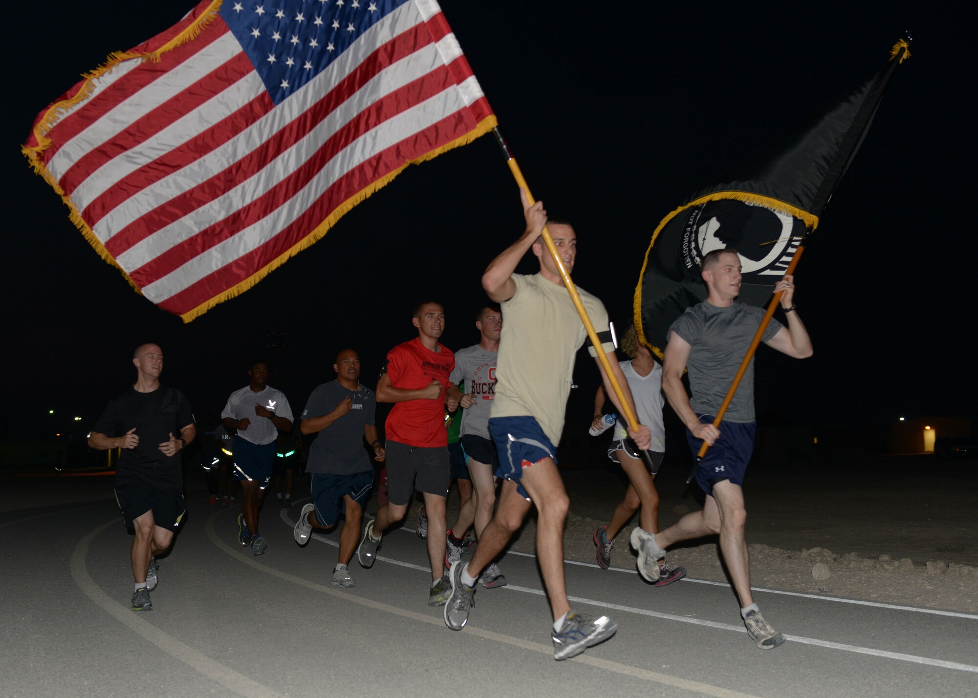 Grand Slam service members participate in the 24-hour prisoner of war and missing in action vigil run at the 379th Air Expeditionary Wing in Southwest Asia, Sept. 20, 2013. The United States League of Families POW/MIA flag remained in constant motion traveling 960 miles, symbolizing the commitment of the U.S. people, armed forces and government to never forget the sacrifices POW/MIAs have made. (U.S. Air Force photo/Senior Airman Bahja J. Jones) 



