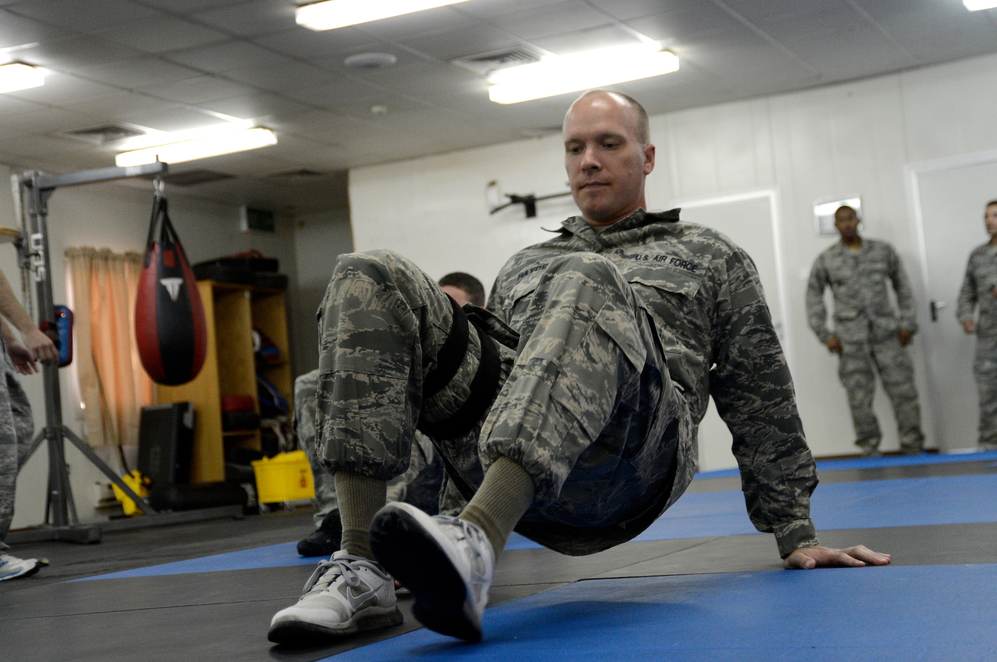 Tech Sgt. Dustin Hayden, 386th Air Expeditionary Wing, ground safety technician, performs a crab walk here, Sept. 19, 2013. Hayden is participating in a combatives class and is required to do this exercise before instruction begins to simulate an adrenalin boost.  Hayden is deployed out of the 20th Fighter Wing, Shaw Air Force Base, Sumter, S.C., and is a native of Mont Belvieu, Texas. (U.S. Air Force photo by Master Sgt. Christopher A. Campbell)