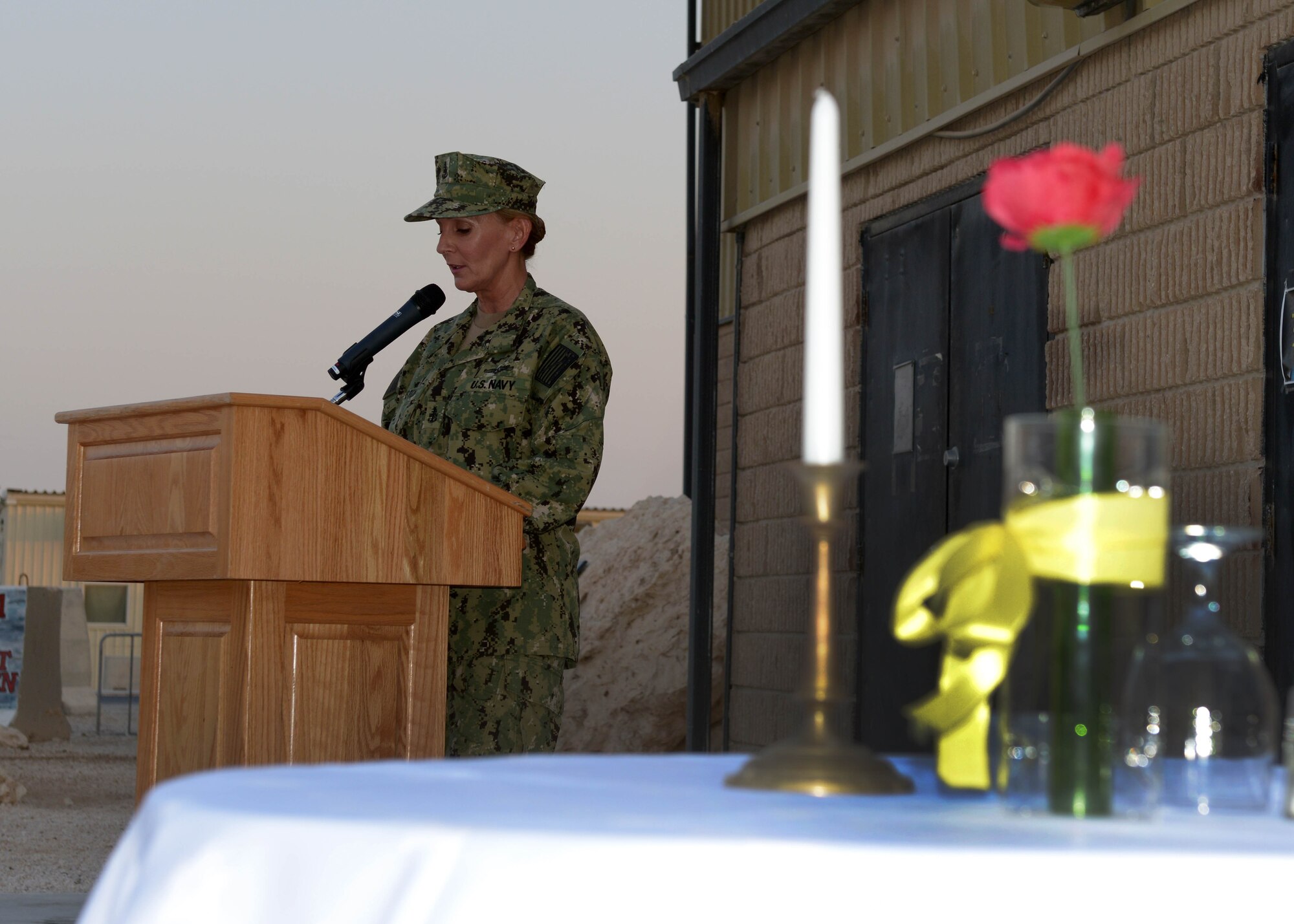 Senior Chief Petty Officer Laura Johnston provides closing remarks at a prisoner of war and missing in action remembrance ceremony at the 379th Air Expeditionary Wing in Southwest Asia, Sept. 20, 2013. Johnston is the Combined Air and Space Operations Center Naval and Amphibious Liaison Element leading senior chief petty officer deployed from Fort George G. Meade, Md., and hails from Oklahoma City, Okla. (U.S. Air Force photo/Senior Airman Bahja J. Jones) 