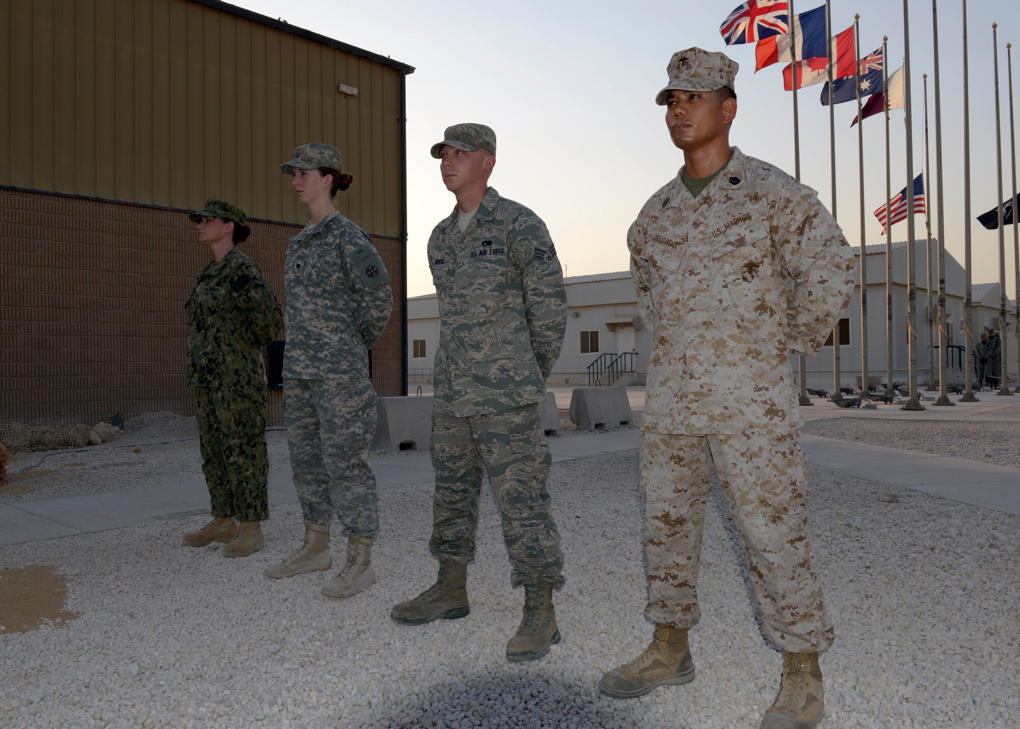 Service members representing the Army, Navy, Marine Corps and Air Force participate in a prisoners of war and missing in action remembrance ceremony at the 379th Air Expeditionary Wing in Southwest Asia, Sept. 20, 2013. Every year on the third Friday in September, military installations and ships, schools and churches throughout the nation pay tribute to honor the commitment and sacrifices of prisoners of war as well as those who are still missing in action. (U.S. Air Force photo/Senior Airman Bahja J. Jones) 