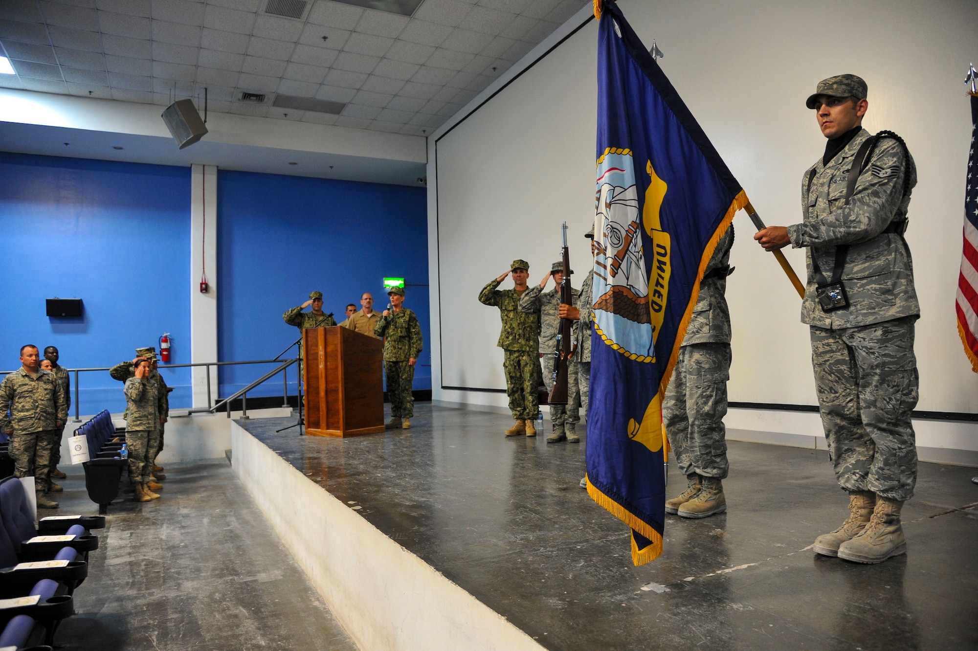 Senior Chief Petty Officer Laura Johnston sings the national anthem during the chief petty officer pinning ceremony at the 379th Air Expeditionary Wing in Southwest Asia, Sept. 21, 2013. Rich in traditions and rituals, which guide much of Navy life, the chief petty officer pinning ceremony is preserved to ensure Sailors stay consistent with the Navy’s core values of honor, courage and commitment. Johnston is the Combined Air and Space Operations Center Naval and Amphibious Liaison Element leading senior chief petty officer deployed from Fort George G. Meade, Md., and hails from Oklahoma City, Okla. (U.S. Air Force photo/Tech. Sgt. Joselito Aribuabo)
