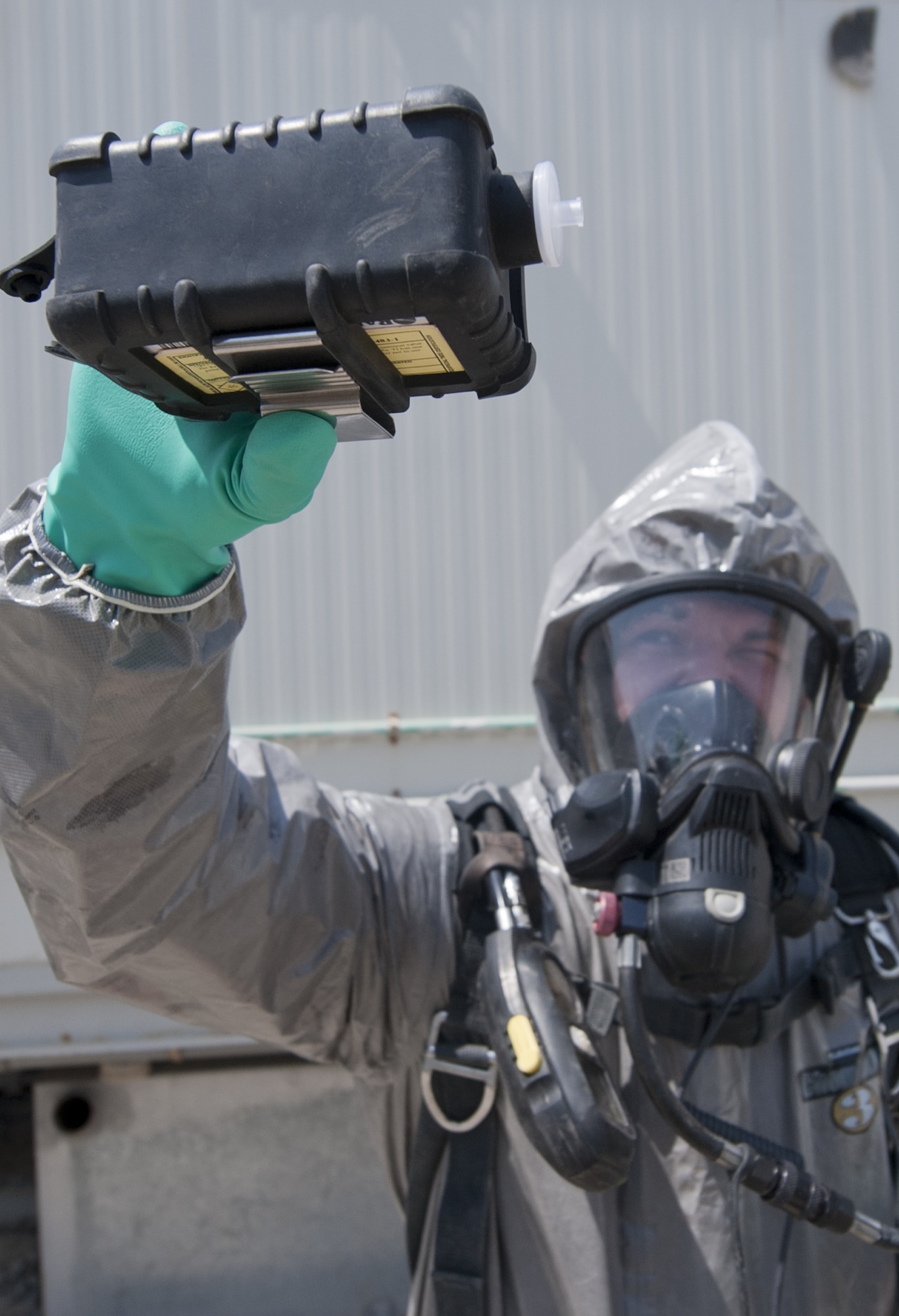 U.S. Air Force Staff Sgt. James Archebelle, 380th Expeditionary Civil Engineer Squadron emergency management journeyman, uses a multi-rae hazardous gas detector on scene of an exercise chemical threat area at an undisclosed location in Southwest Asia Sept. 20, 2013. The hazardous gas detector can detect multiple hazardous gases in the area. Archebelle calls Festus, Mo., home and is deployed from Joint Base McGuire-Dix-Lakehurst, N.J. (U.S. Air Force photo by Staff Sgt. Jacob Morgan)