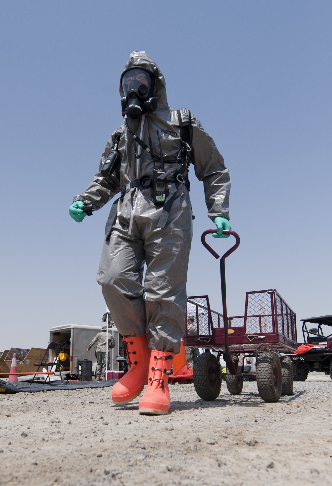 U.S. Air Force Senior Airman Jeremy Harrison, 380th Expeditionary Civil Engineer Squadron emergency management journeyman, responds to an exercise chemical threat at an undisclosed location in Southwest Asia Sept. 20, 2013. The goal of the exercise was to further train emergency management personnel on responding to a chemical threat. Harrison calls Houston, Texas, home and is deployed from Ellsworth Air Force Base, S.D. (U.S. Air Force photo by Staff Sgt. Jacob Morgan)