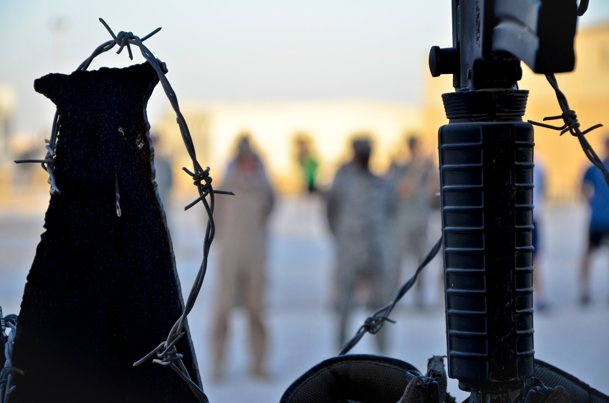 Deployed U.S. service members, coalition and mission partners gather for a prisoners of war and missing in action remembrance ceremony at the 379th Air Expeditionary Wing in Southwest Asia, Sept. 21, 2013. In the United States, National POW/MIA Recognition Day is observed on the third Friday in September and honors those who were prisoners of war and those who are still missing in action. The day was established by an Act of Congress and is one of six days the POW/MIA flag can be flown. (U.S. Air Force photo/Staff Sgt. Benjamin W. Stratton)