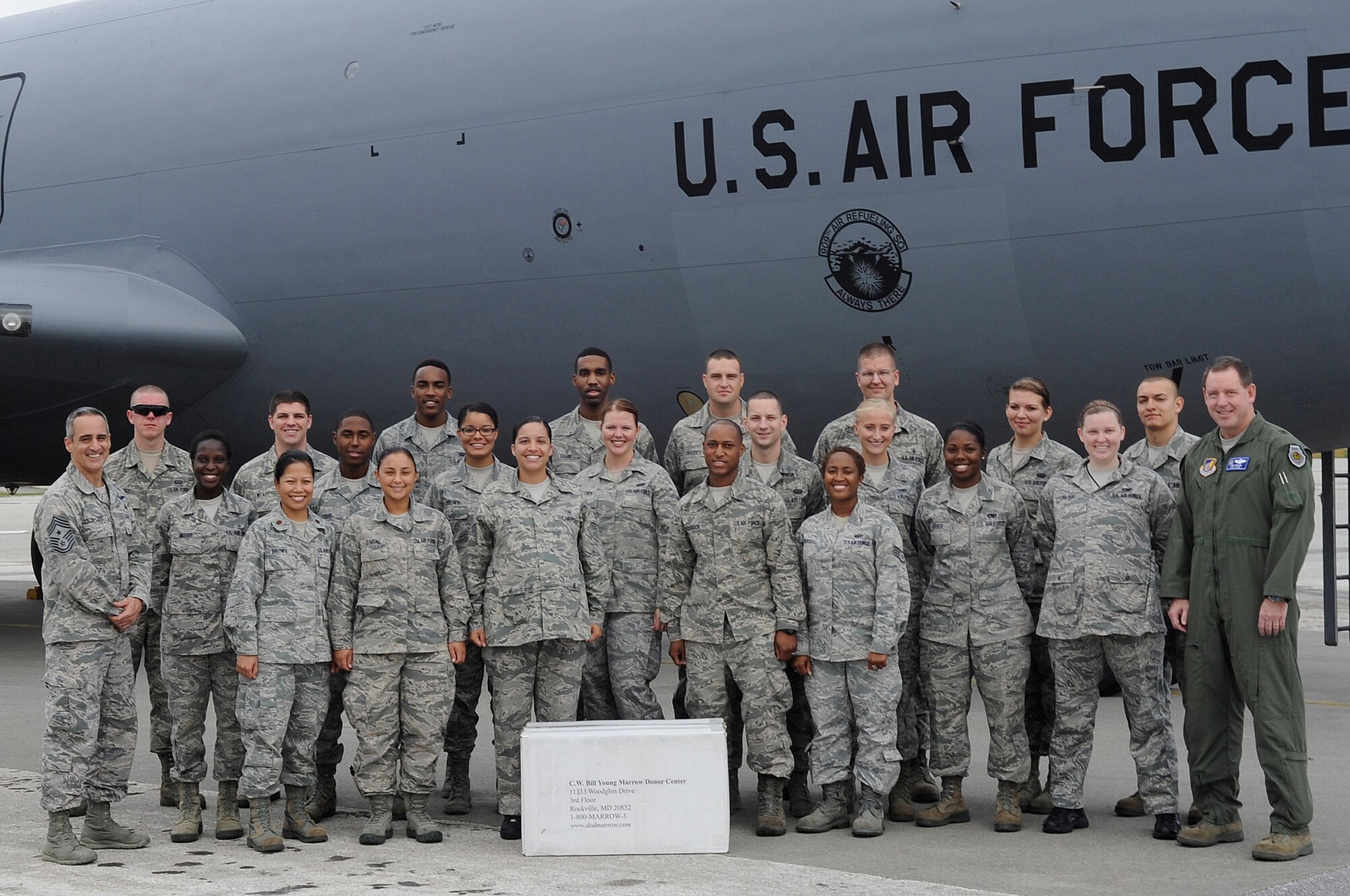 U.S. Air Force Brig. Gen. James Hecker (right), 18th Wing commander, and Chief Master Sgt. Ramon Colon-Lopez (left), 18th Wing command chief, pose with volunteers from the bone marrow drive Sept. 27, 2013, on Kadena Air Base, Japan. The volunteers worked at nine registration sites and spent a total of 277 hours to draw in more than 900 new potential donors. (U.S. Air Force photo by Senior Airman Marcus Morris) 