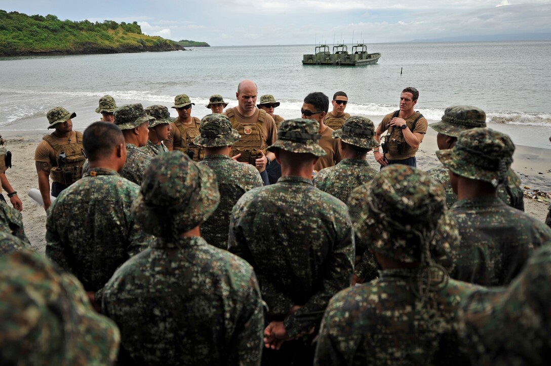 U.S. Navy Petty Officer 1st Class Cory Allen trains Philippine marines on the fundamentals of small boats during a Philippine bilateral exercise on Philippine Marine Base Ternate in Ternate, Philippines, Sept. 18, 2013.