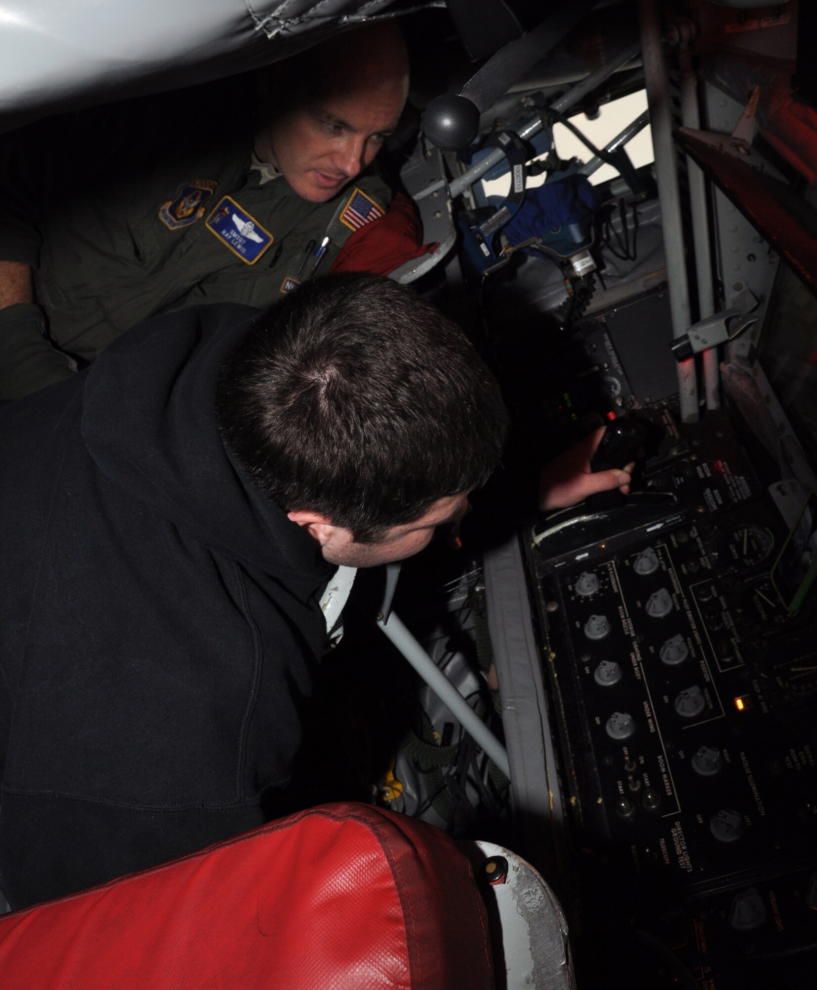 Senior Master Sgt. Ray Lewis, a boom operator from the 931st Air Refueling Group, shows a Boy Scout from Boy Scout Troop 683 of Derby, Kan. how the boom pod works in a KC-135 Stratotanker at McConnell AFB, Kan., Sept. 28. Boy Scouts from Troop 683 were at McConnell from Sept. 27 - 29 learning about the Air Force and Air Force Reserve. (Air Force photo by Master Sgt. Brannen Parrish)