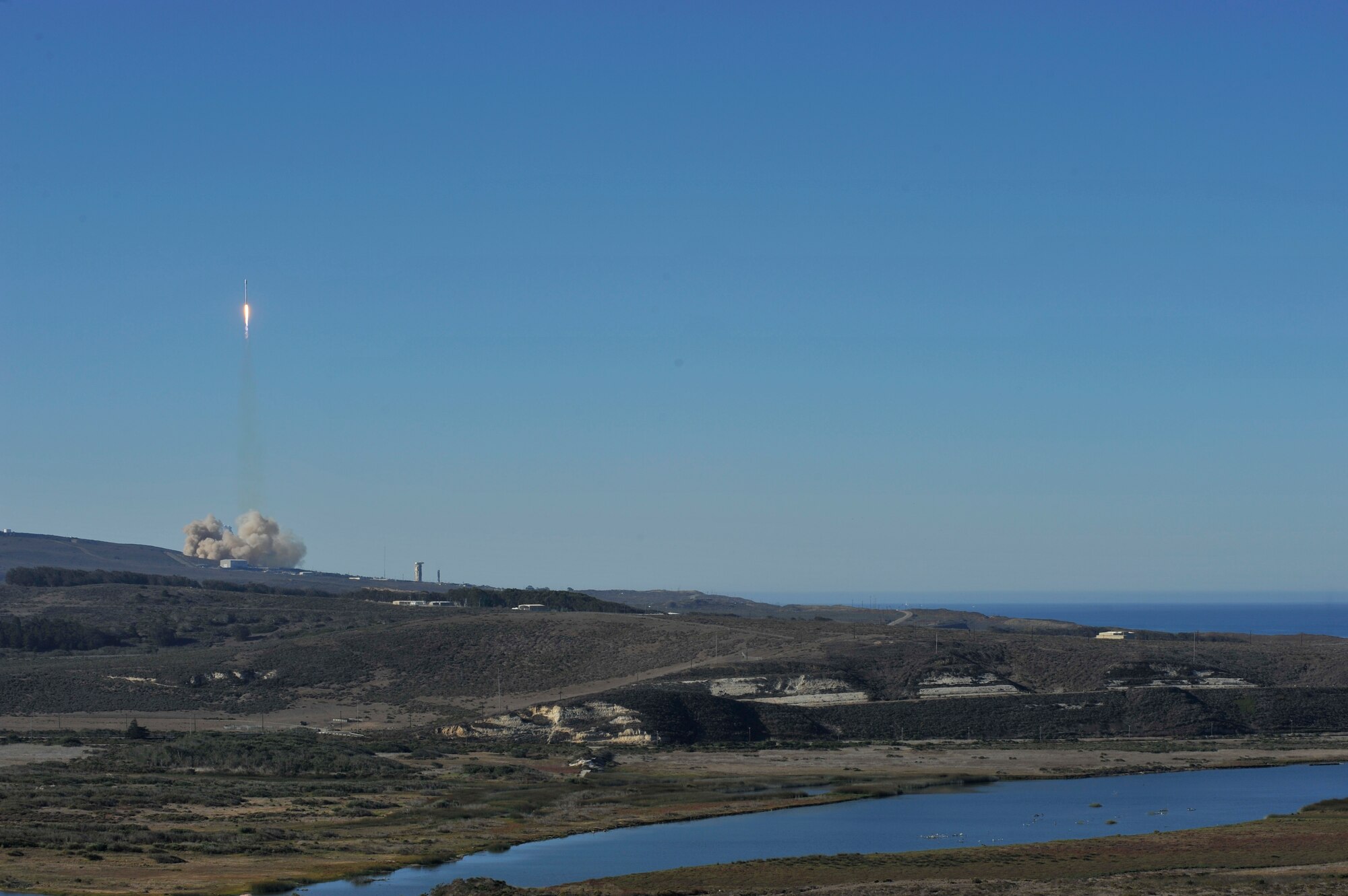 VANDENBERG AIR FORCE BASE, Calif. -- Team Vandenberg launches its first-ever SpaceX launch from Space Launch Complex-4 here Sunday, Sept. 29, 2013. 30th Space Wing's 1st Air and Space Test Squadron was the lead for all launch site certification activities at Vandenberg for SpaceX as an Evolved Expendable Launch Vehicle New Entrant. Under the authority of the Space and Missile Systems Center, the Squadron evaluated SpaceX's flight and ground systems, processes and procedures for this inaugural space launch campaign for the upgraded Falcon-9 rocket.  (U.S. Air Force photo by Michael Peterson/Released)