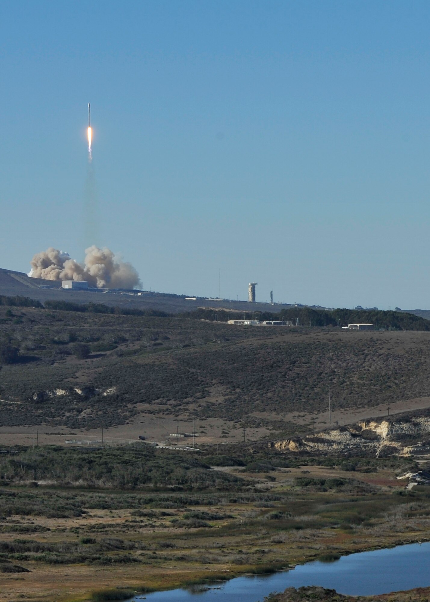 VANDENBERG AIR FORCE BASE, Calif. -- Team Vandenberg launches its first-ever SpaceX launch from Space Launch Complex-4 here Sunday, Sept. 29, 2013. 30th Space Wing's 1st Air and Space Test Squadron was the lead for all launch site certification activities at Vandenberg for SpaceX as an Evolved Expendable Launch Vehicle New Entrant. Under the authority of the Space and Missile Systems Center, the Squadron evaluated SpaceX's flight and ground systems, processes and procedures for this inaugural space launch campaign for the upgraded Falcon-9 rocket. (U.S. Air Force photo by Michael Peterson/Released)