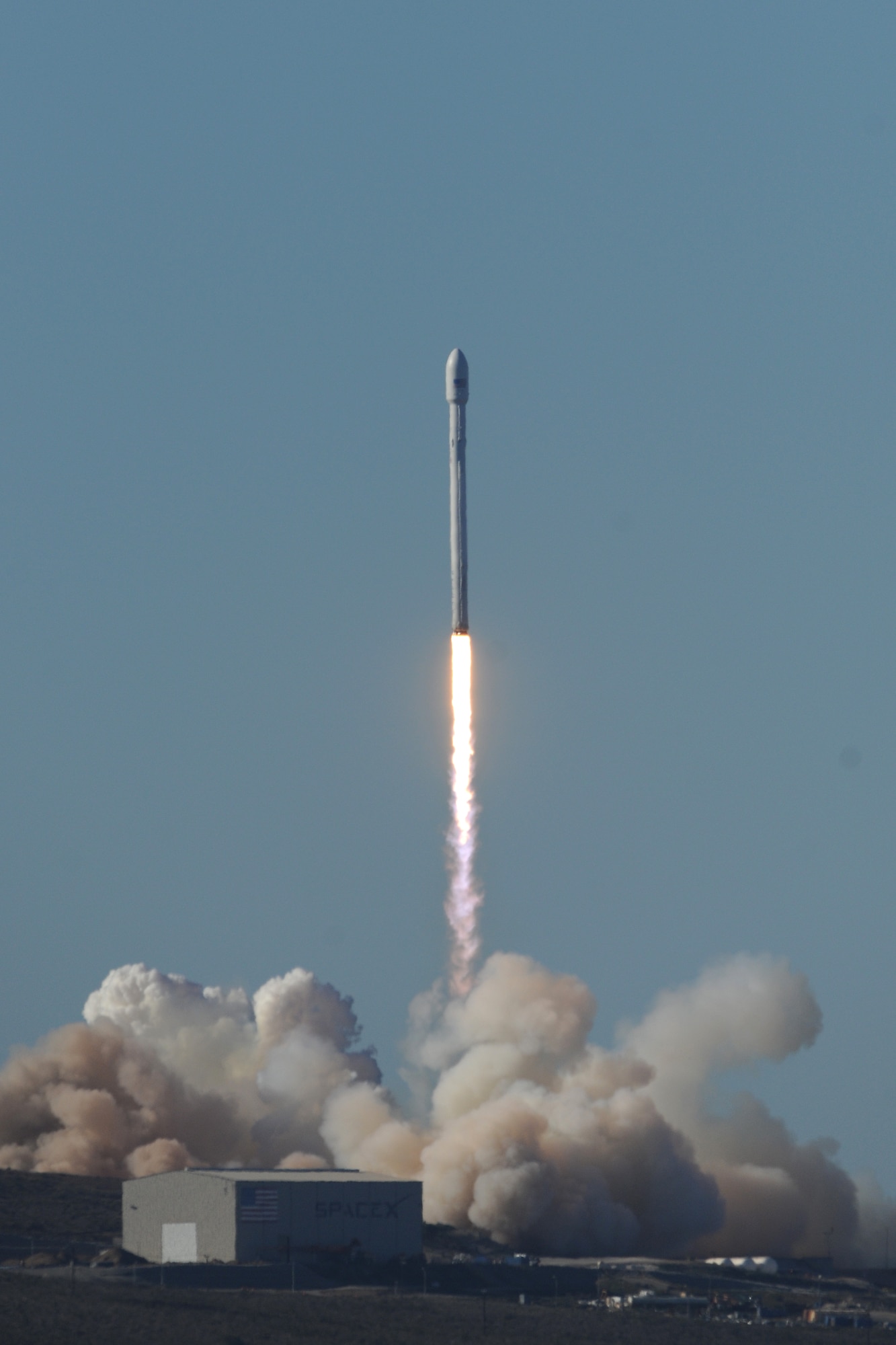 VANDENBERG AIR FORCE BASE, Calif. -- Team Vandenberg launches its first-ever SpaceX launch from Space Launch Complex-4 here Sunday, Sept. 29, 2013. 30th Space Wing's 1st Air and Space Test Squadron was the lead for all launch site certification activities at Vandenberg for SpaceX as an Evolved Expendable Launch Vehicle New Entrant. Under the authority of the Space and Missile Systems Center, the Squadron evaluated SpaceX's flight and ground systems, processes and procedures for this inaugural space launch campaign for the upgraded Falcon-9 rocket. (U.S. Air Force photo by Michael Peterson/Released)